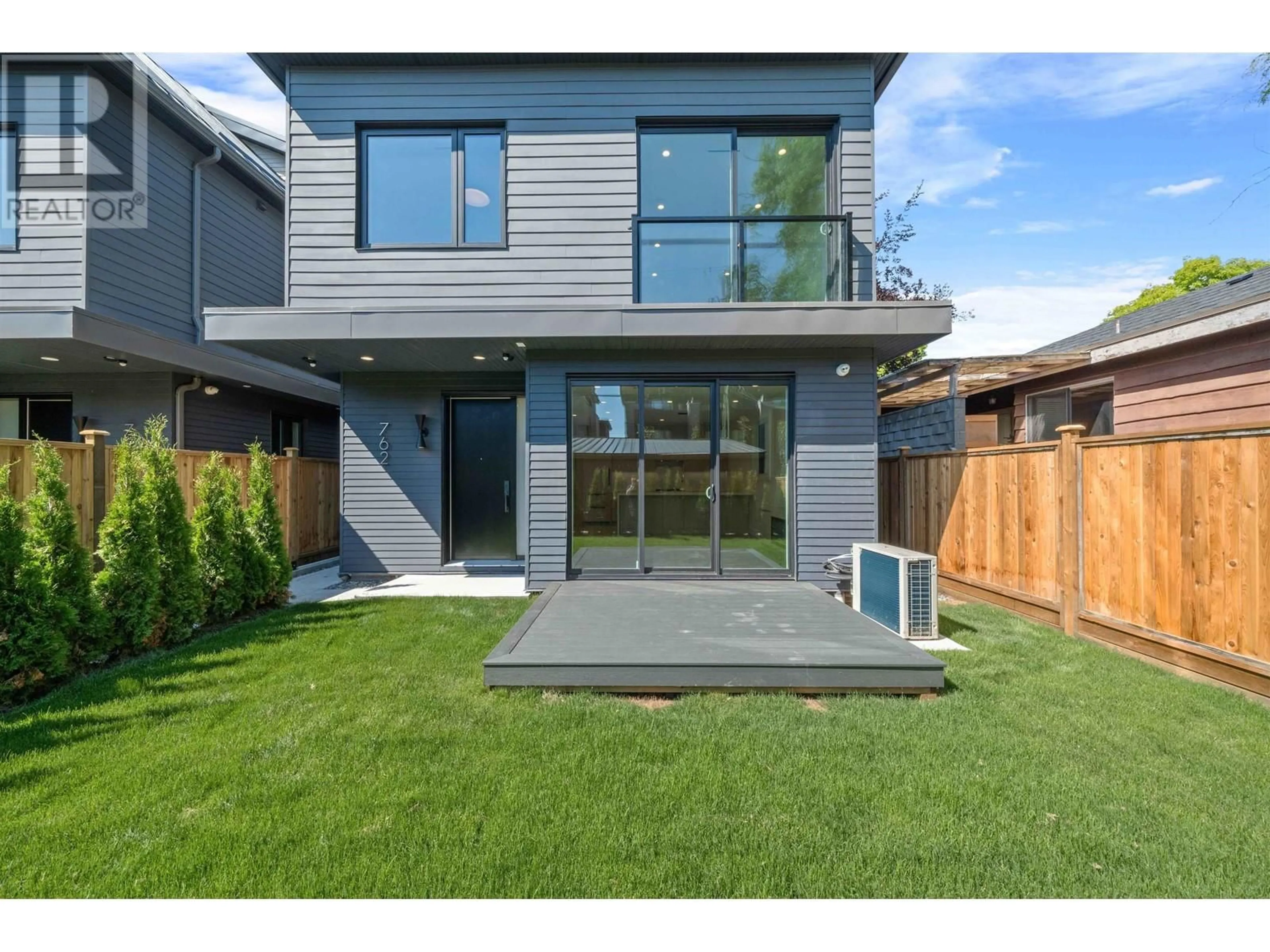 Frontside or backside of a home, the fenced backyard for 2 760 W 48 AVENUE, Vancouver British Columbia V5Z2R9