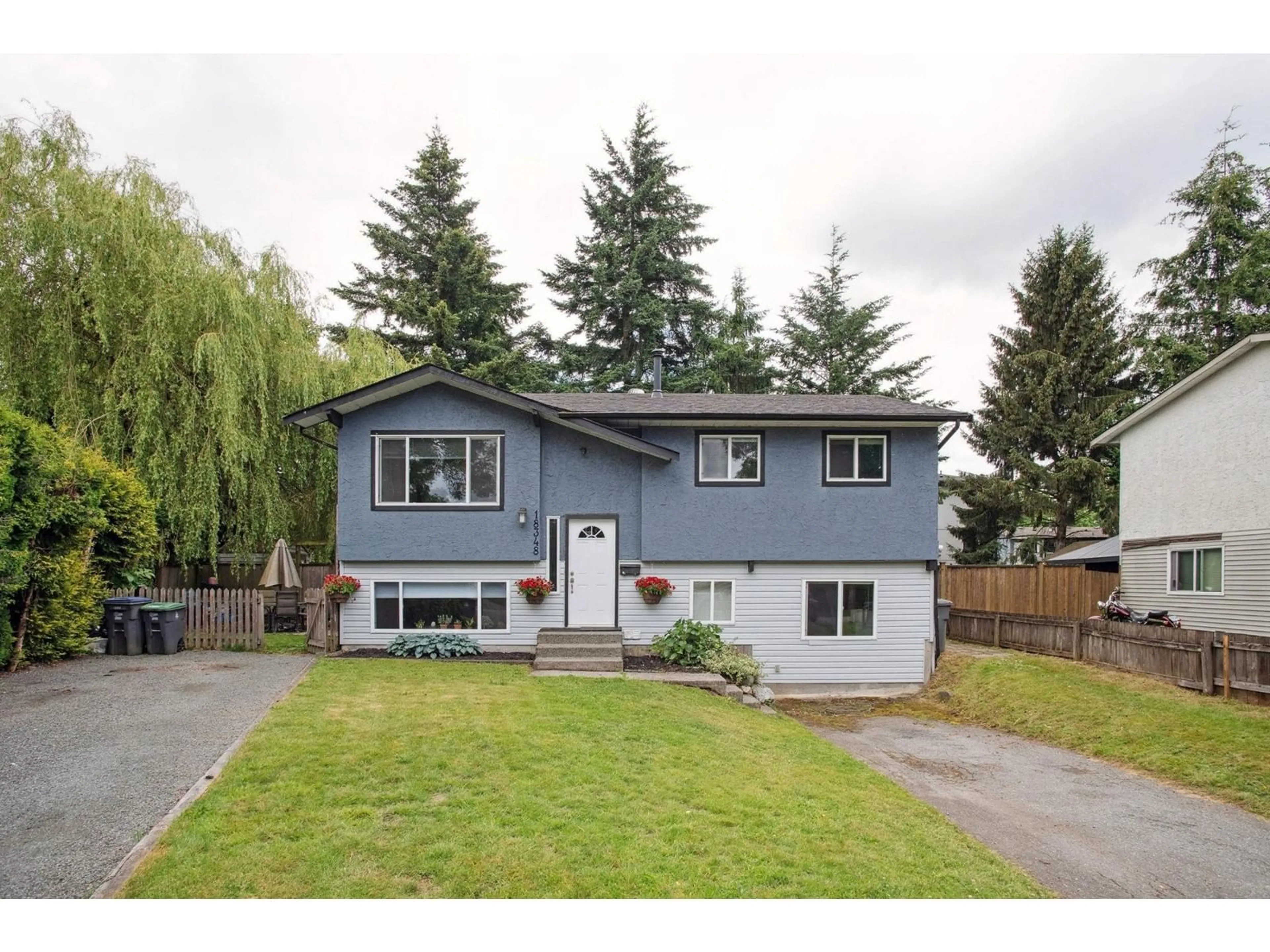 Frontside or backside of a home for 18348 63A AVENUE, Surrey British Columbia V3S8A8