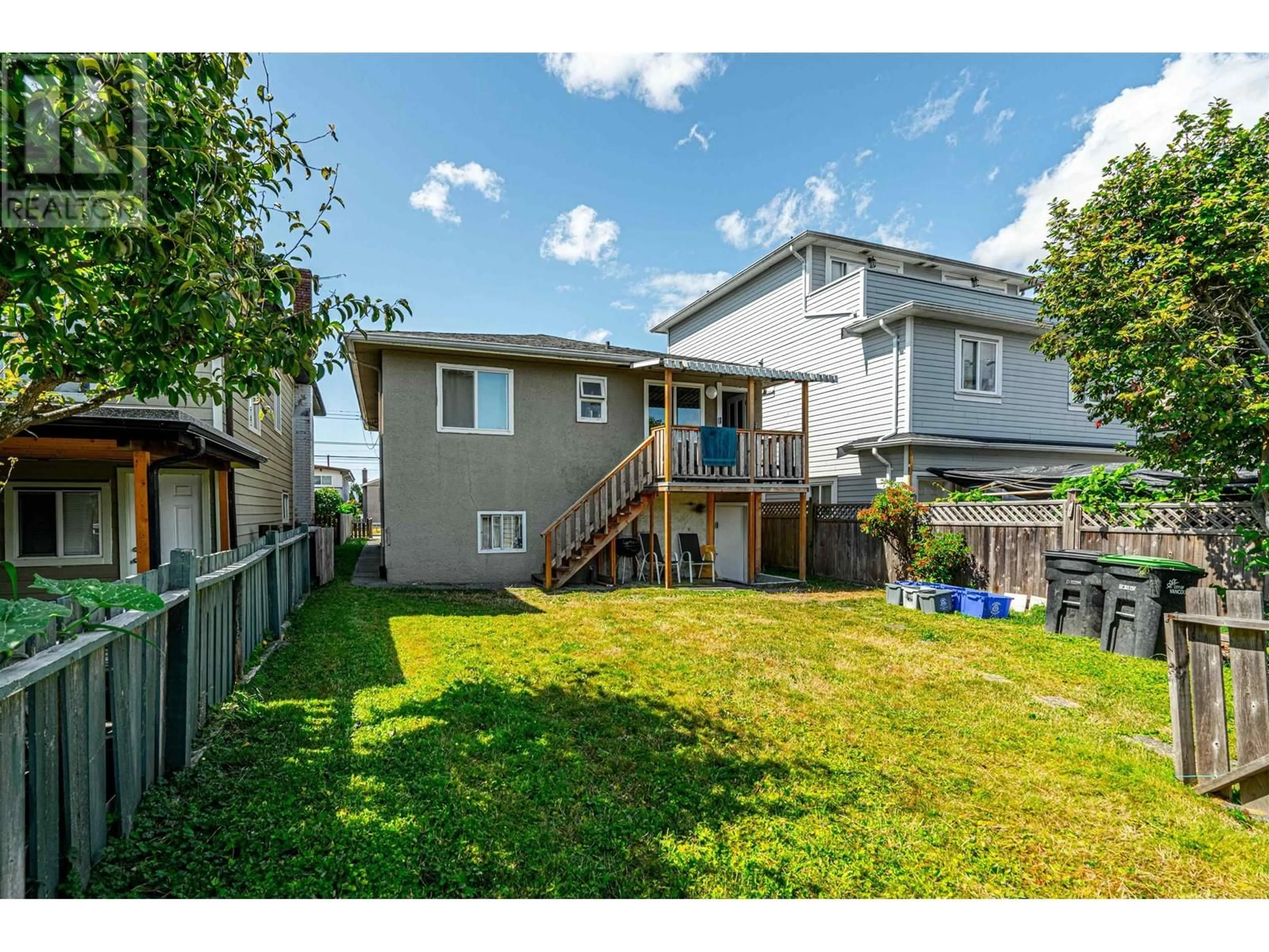 Frontside or backside of a home, the fenced backyard for 4826 EARLES STREET, Vancouver British Columbia V5R3R5