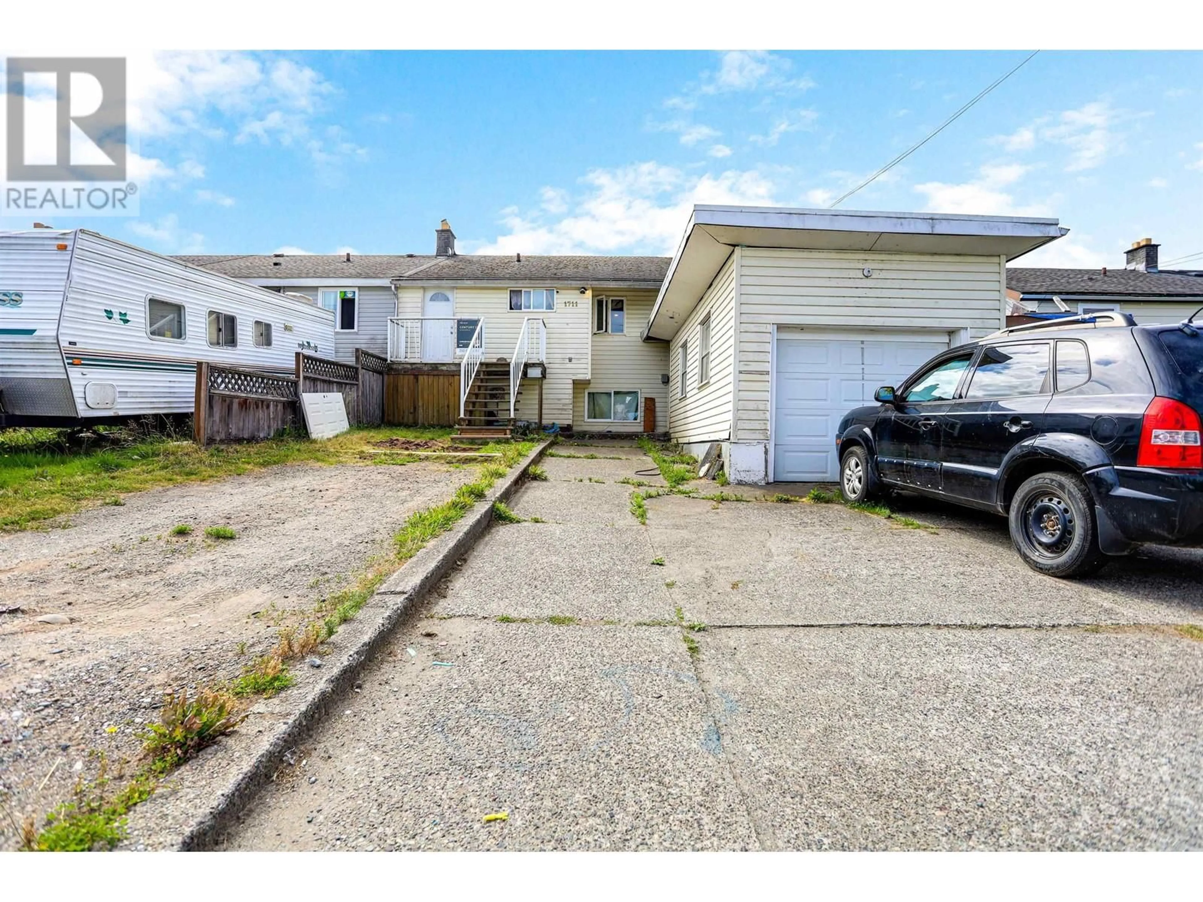 Frontside or backside of a home, the street view for 1711 GYRFALCON AVENUE, Kitimat British Columbia V8C1N7