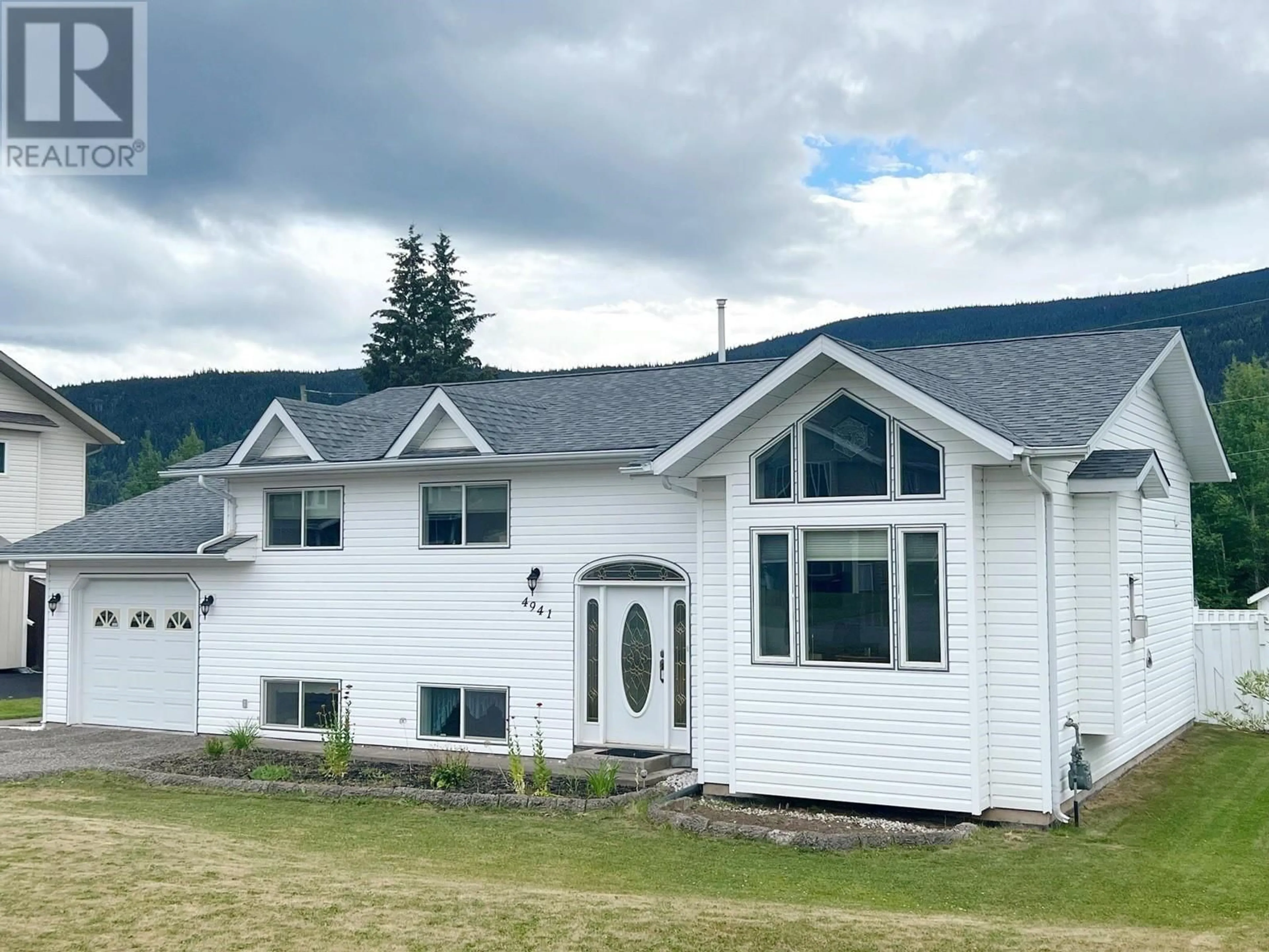 Frontside or backside of a home, the front or back of building for 4941 4TH AVENUE, Smithers British Columbia V0J2N3