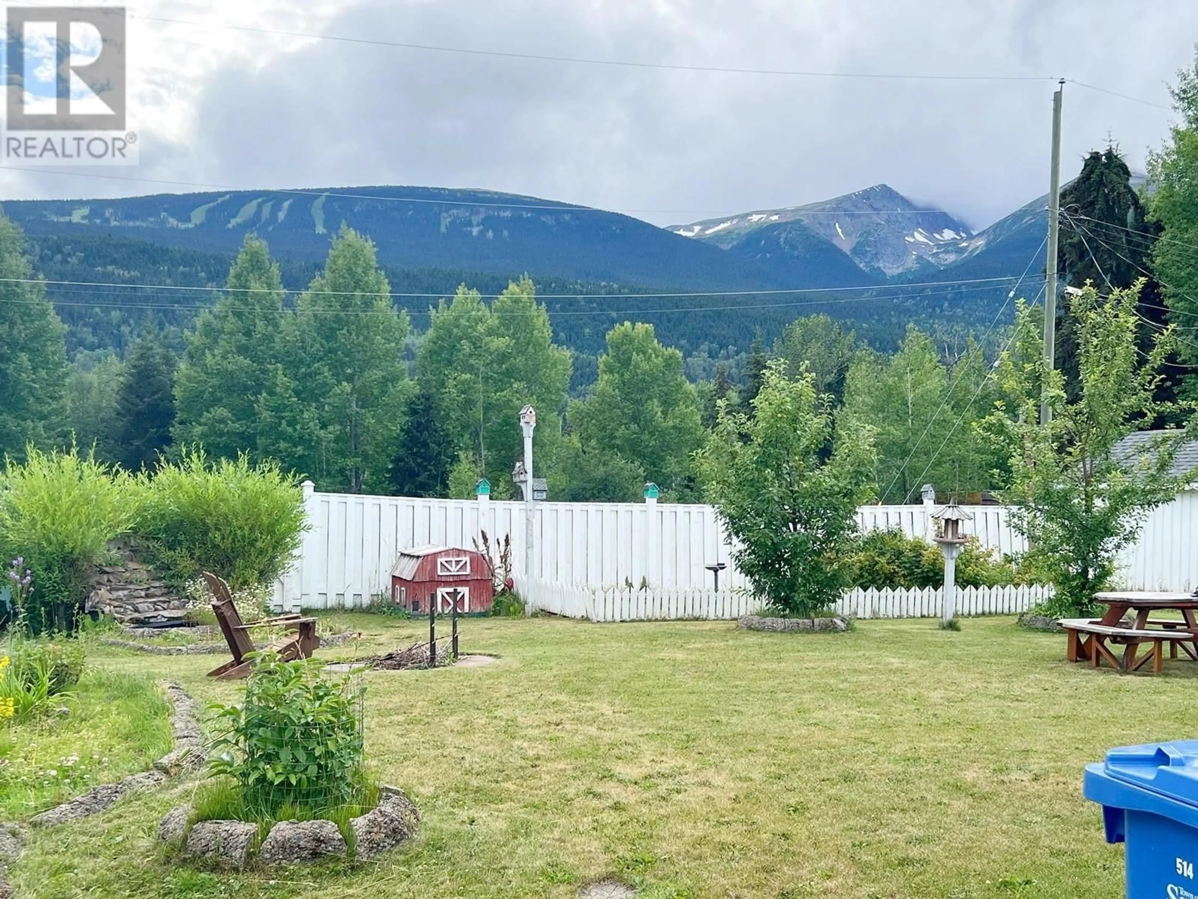 A pic from exterior of the house or condo, the fenced backyard for 4941 4TH AVENUE, Smithers British Columbia V0J2N3