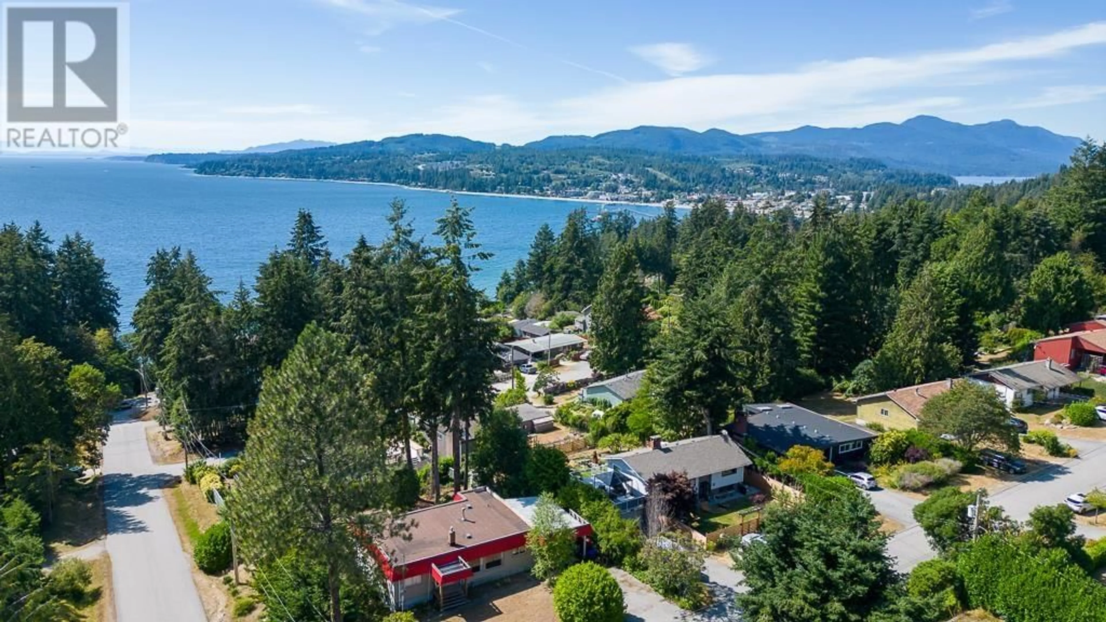 A pic from outside/outdoor area/front of a property/back of a property/a pic from drone, water/lake/river/ocean view for 5197 RADCLIFFE ROAD, Sechelt British Columbia V0N3A2