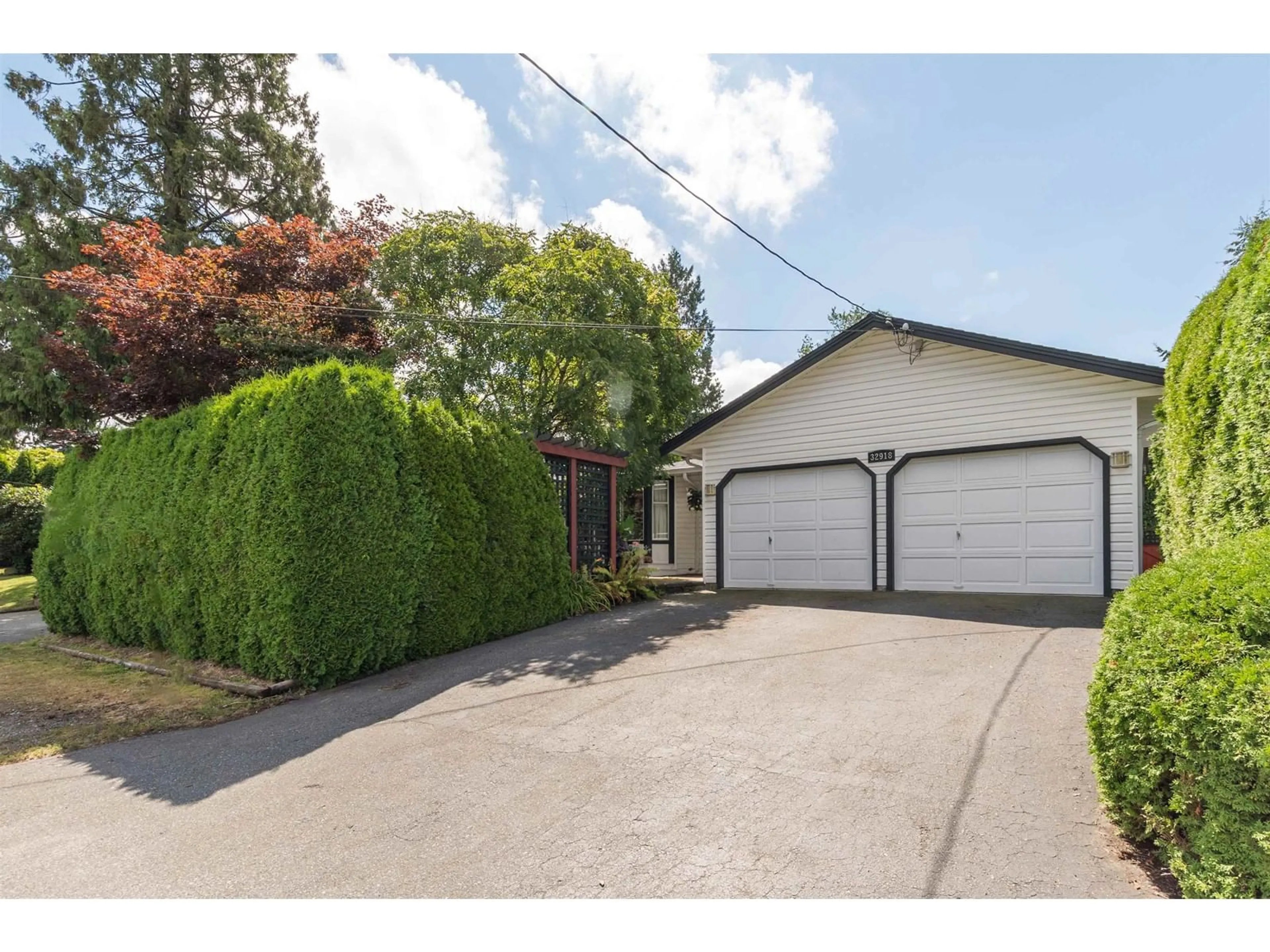 Frontside or backside of a home, the fenced backyard for 32918 14TH AVENUE, Mission British Columbia V2V2P2