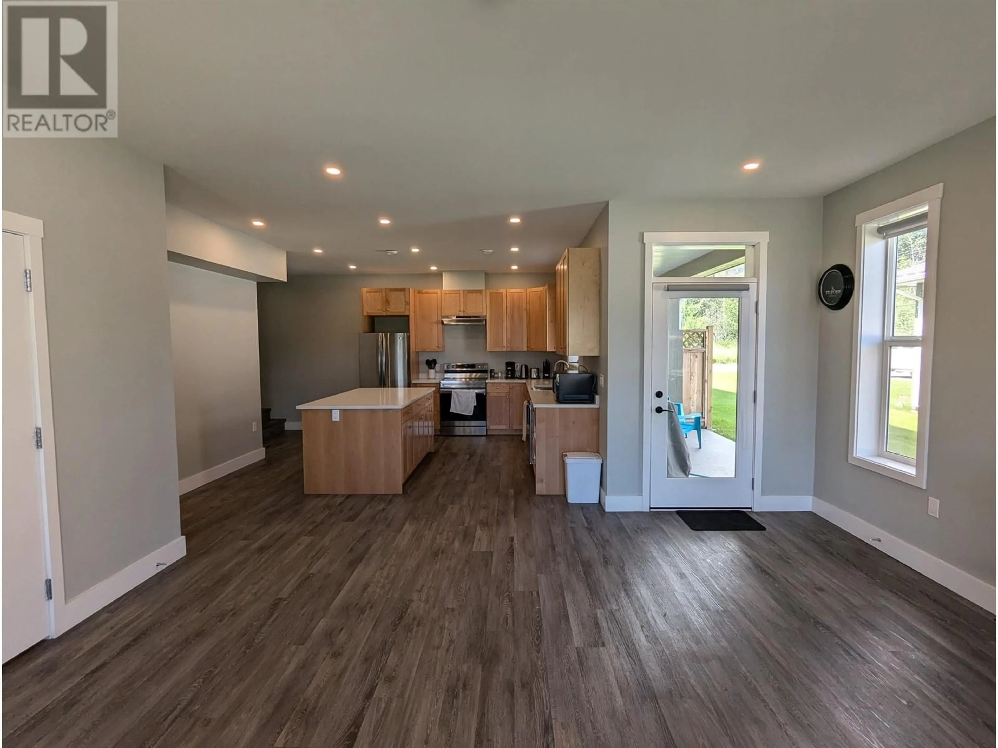 Open concept kitchen, wood/laminate floor for 103 3360 FIRST AVENUE, Smithers British Columbia V0J2N0