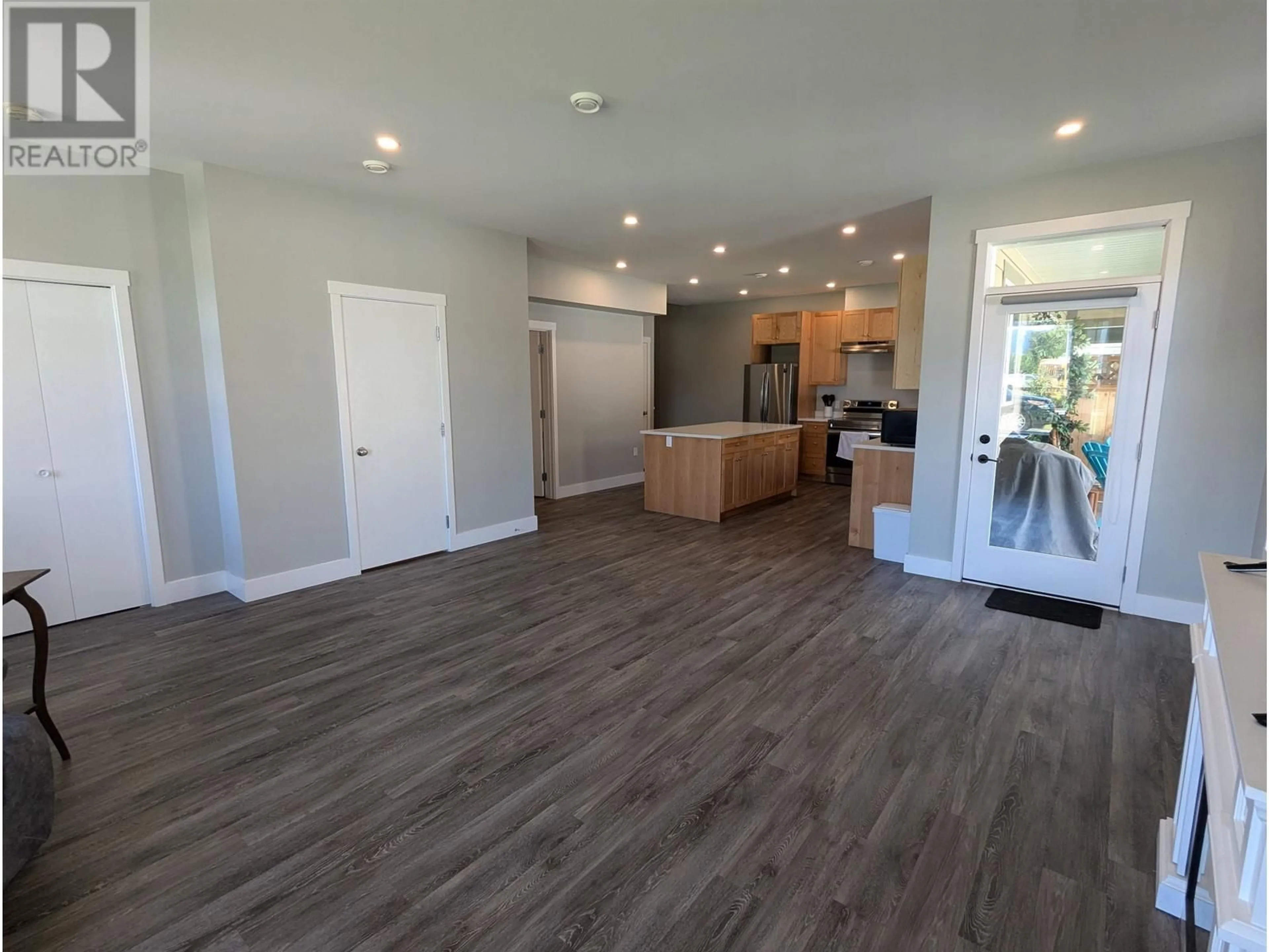 Open concept kitchen, wood/laminate floor for 103 3360 FIRST AVENUE, Smithers British Columbia V0J2N0