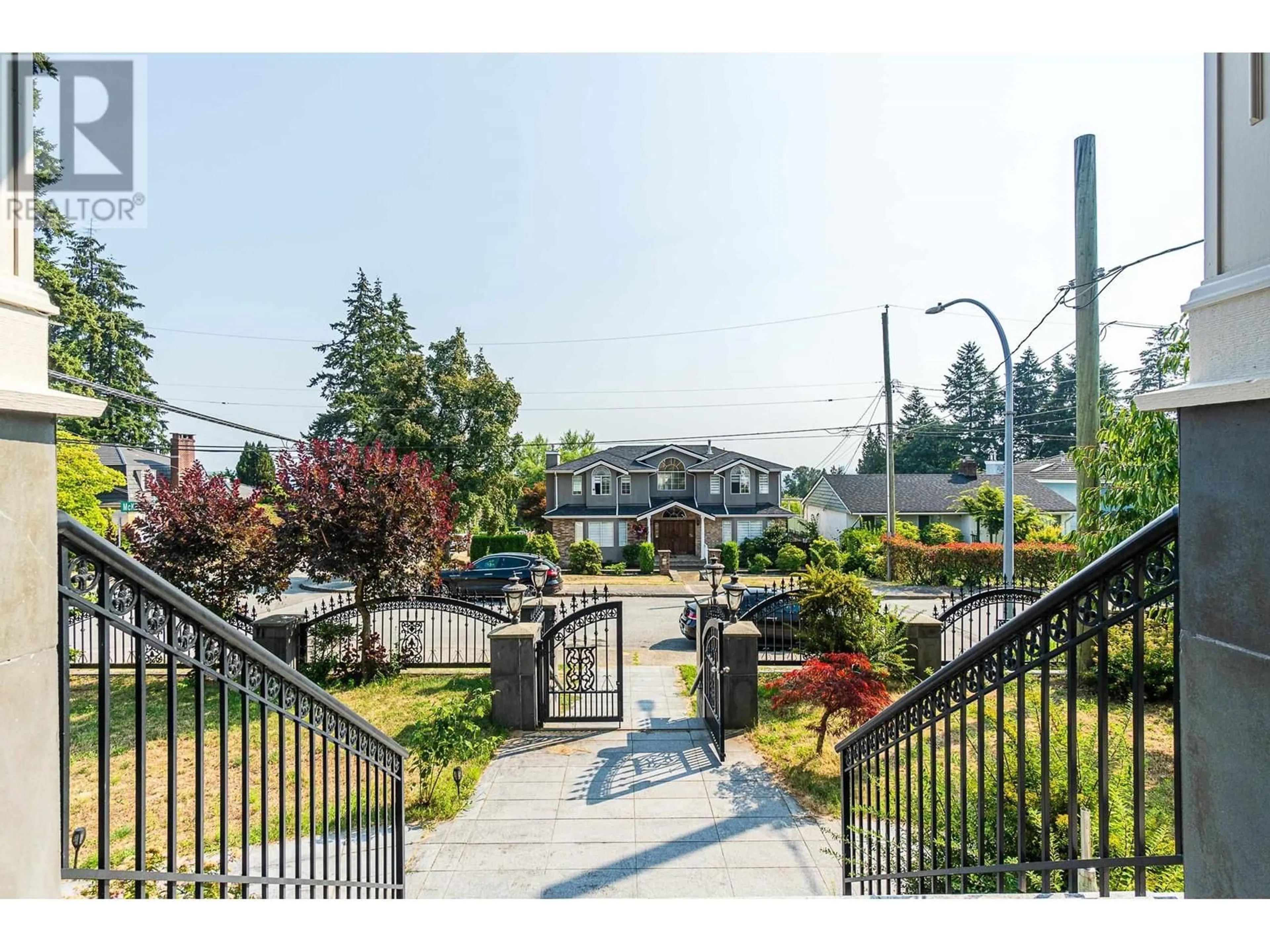 A pic from exterior of the house or condo, the fenced backyard for 5891 MCKEE STREET, Burnaby British Columbia V5J2V4