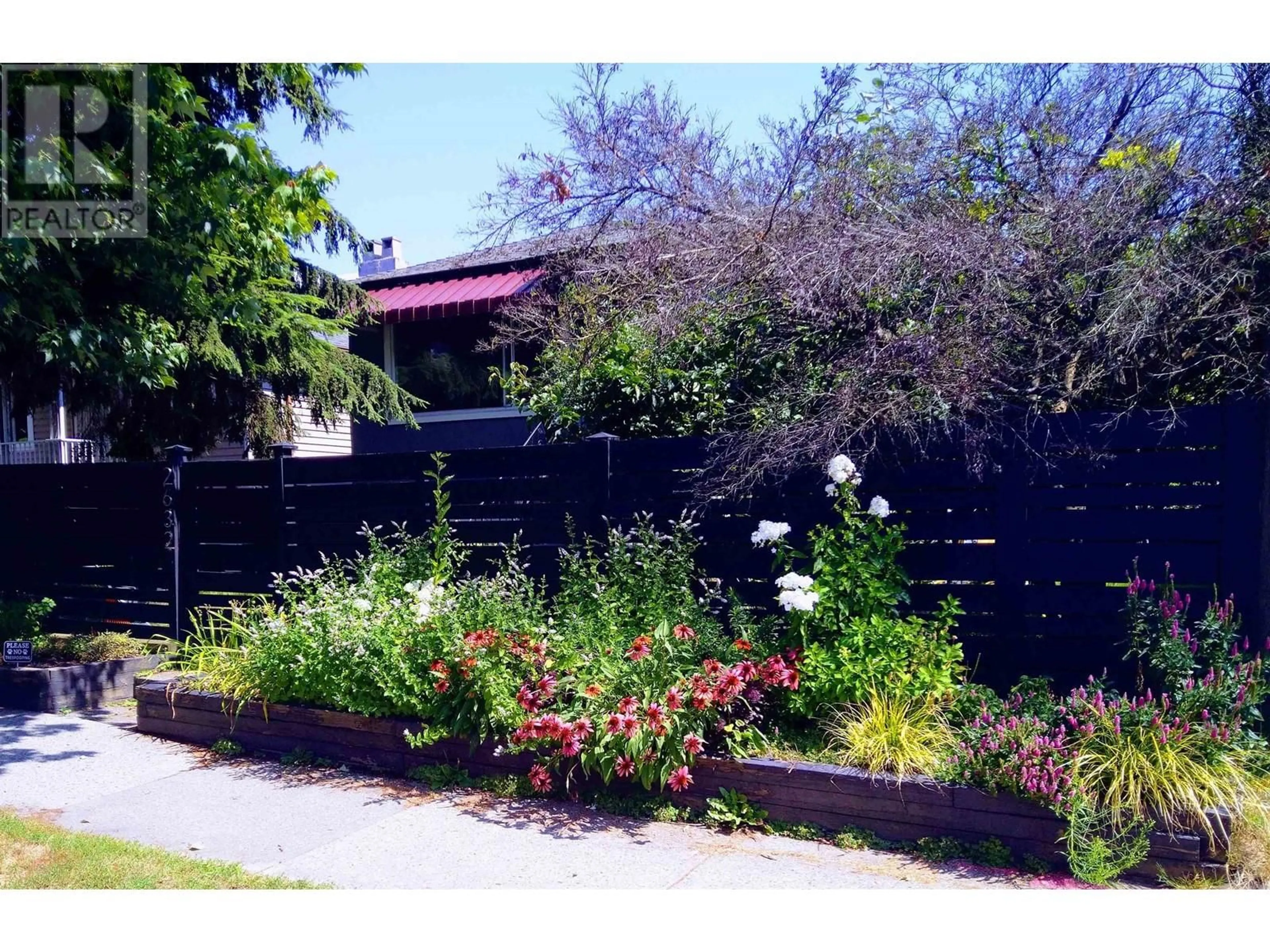 Frontside or backside of a home, the fenced backyard for 2632 NANAIMO STREET, Vancouver British Columbia V5N5E7