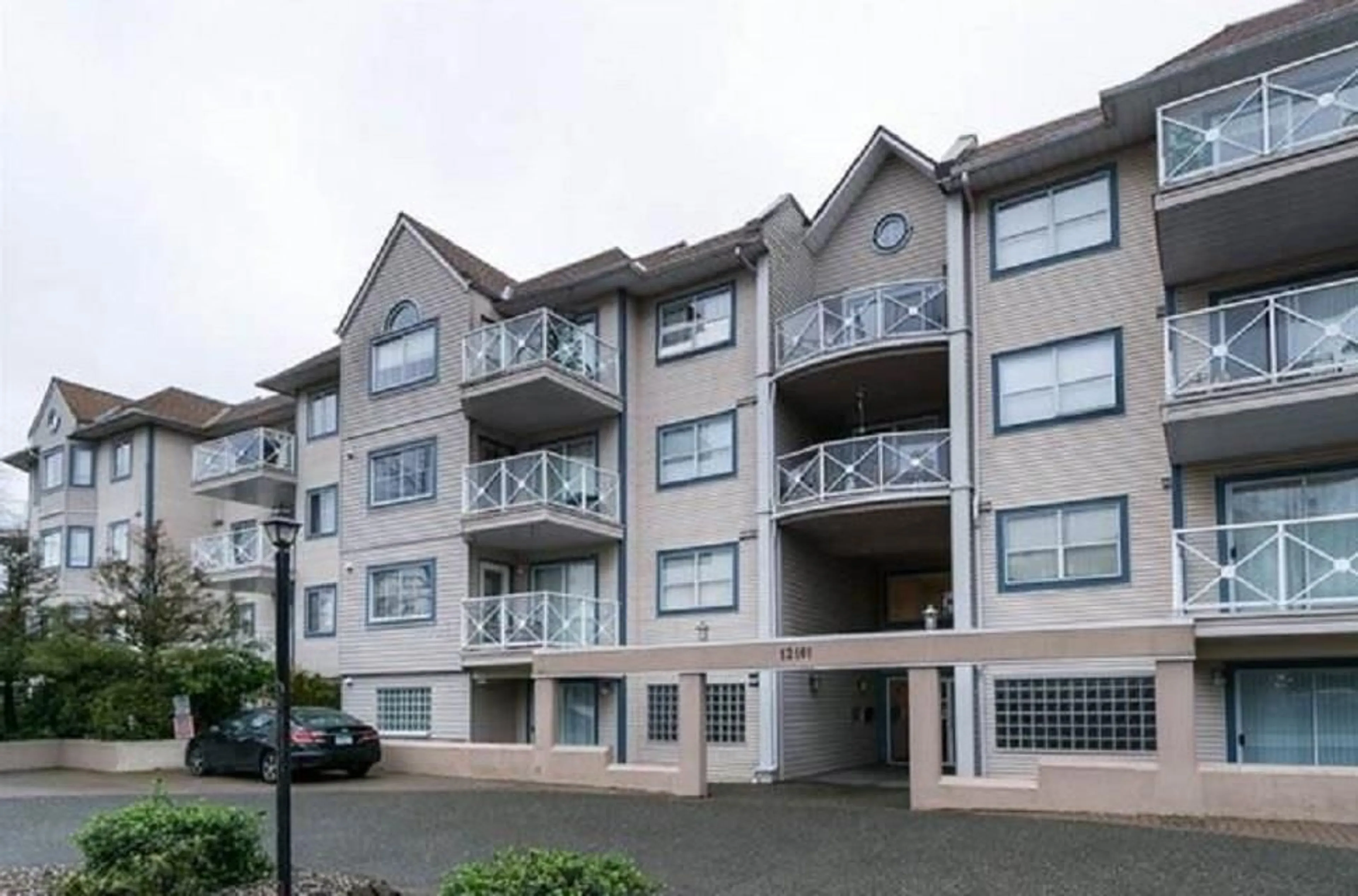 A pic from exterior of the house or condo, the front or back of building for 111 12101 80 AVENUE, Surrey British Columbia V3W5V6