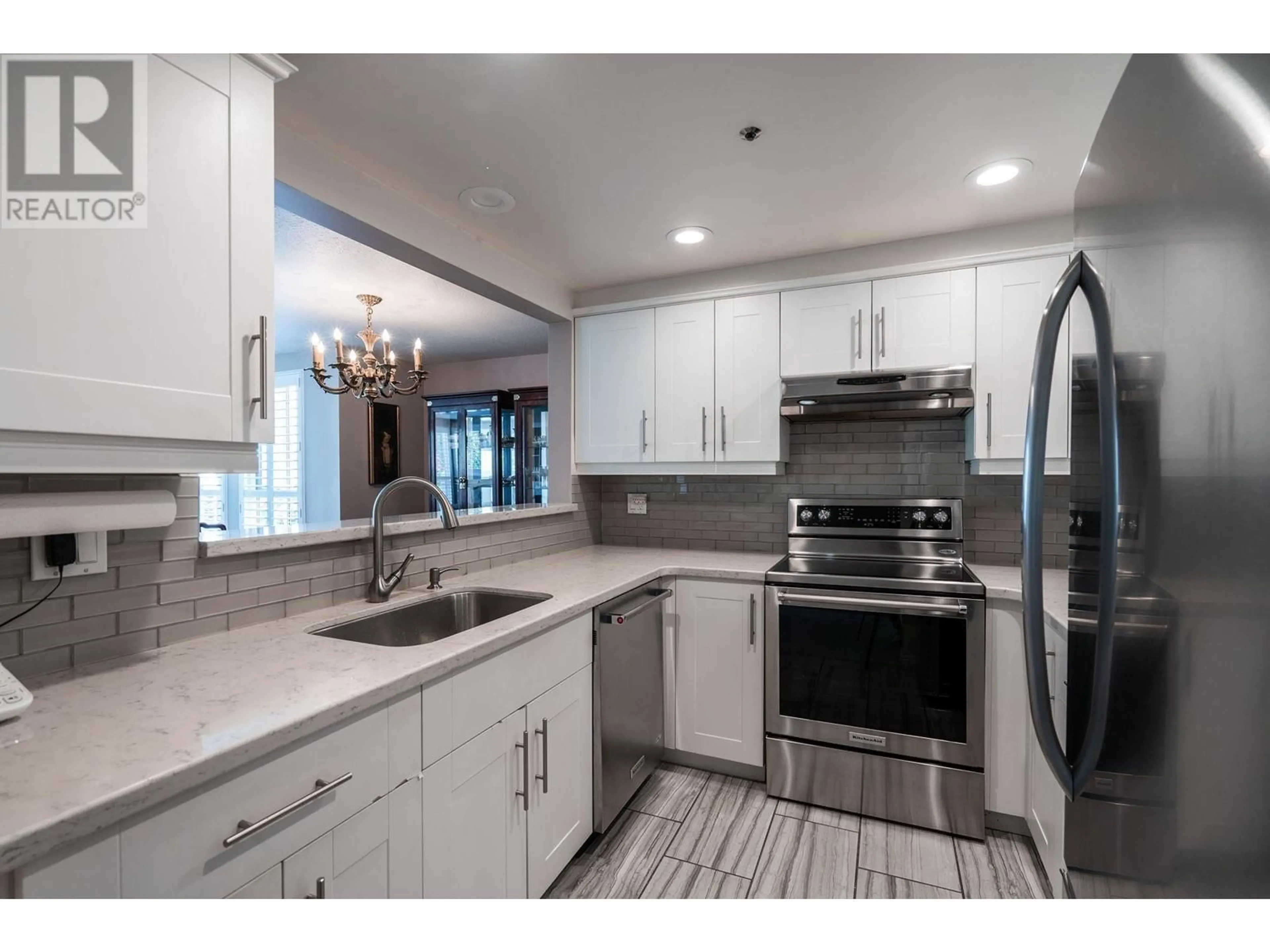 Open concept kitchen, ceramic/tile floor for 107 1502 ISLAND PARK WALK, Vancouver British Columbia V6H3Z8