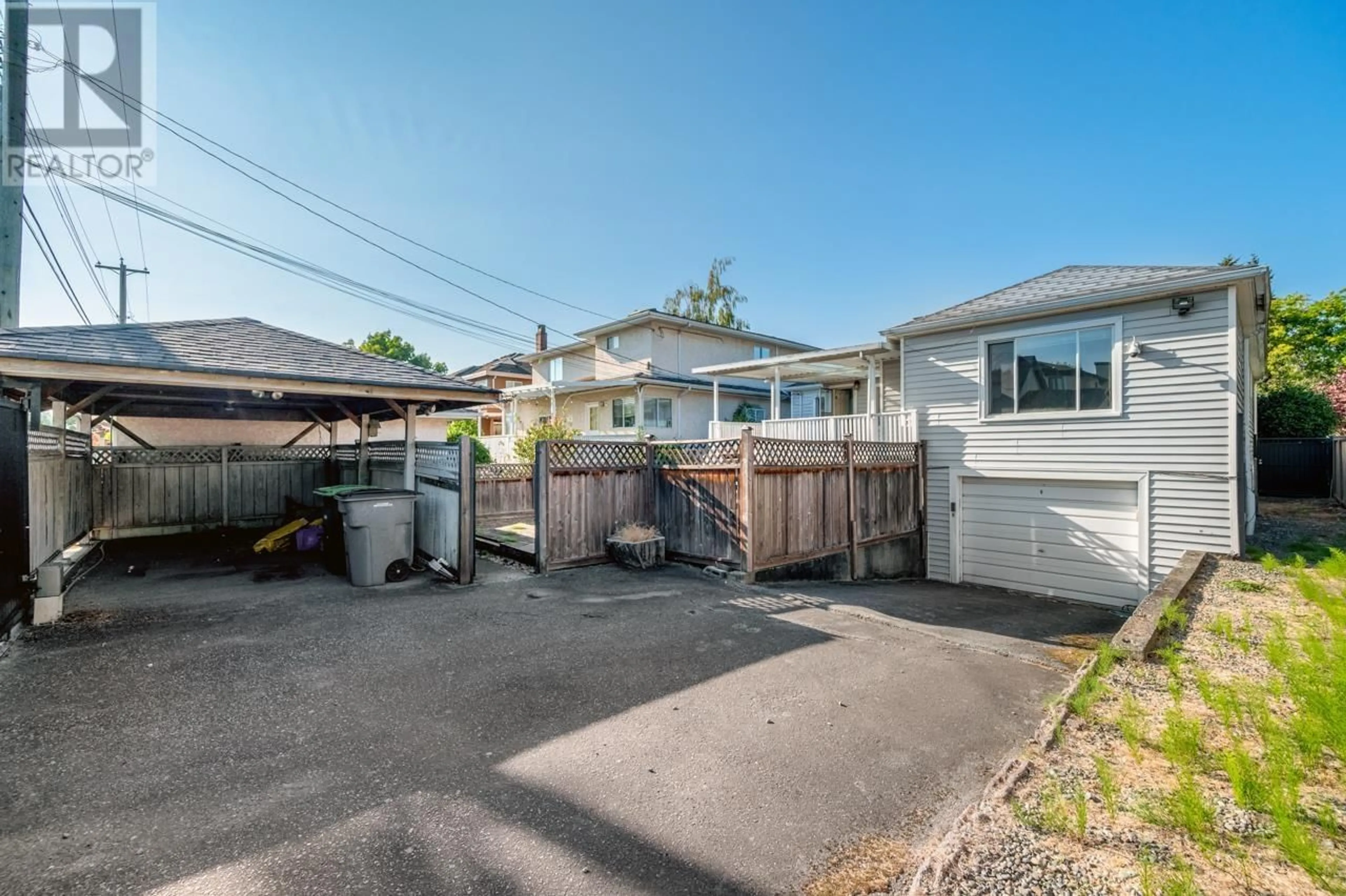 Frontside or backside of a home, the fenced backyard for 2436 W 21ST AVENUE, Vancouver British Columbia V6L1J9