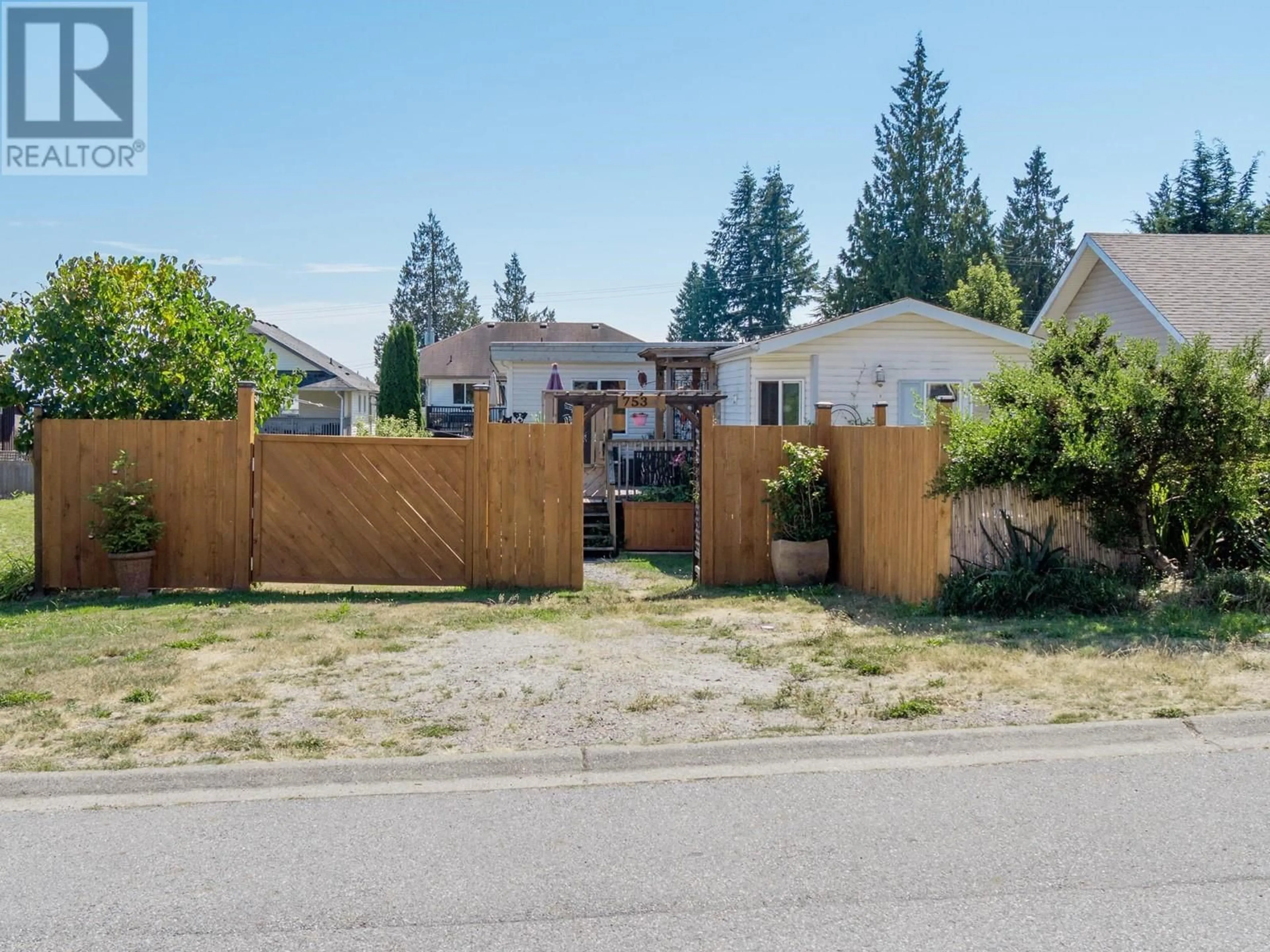 Frontside or backside of a home, the fenced backyard for 753 STEINBRUNNER ROAD, Gibsons British Columbia V0N1V9