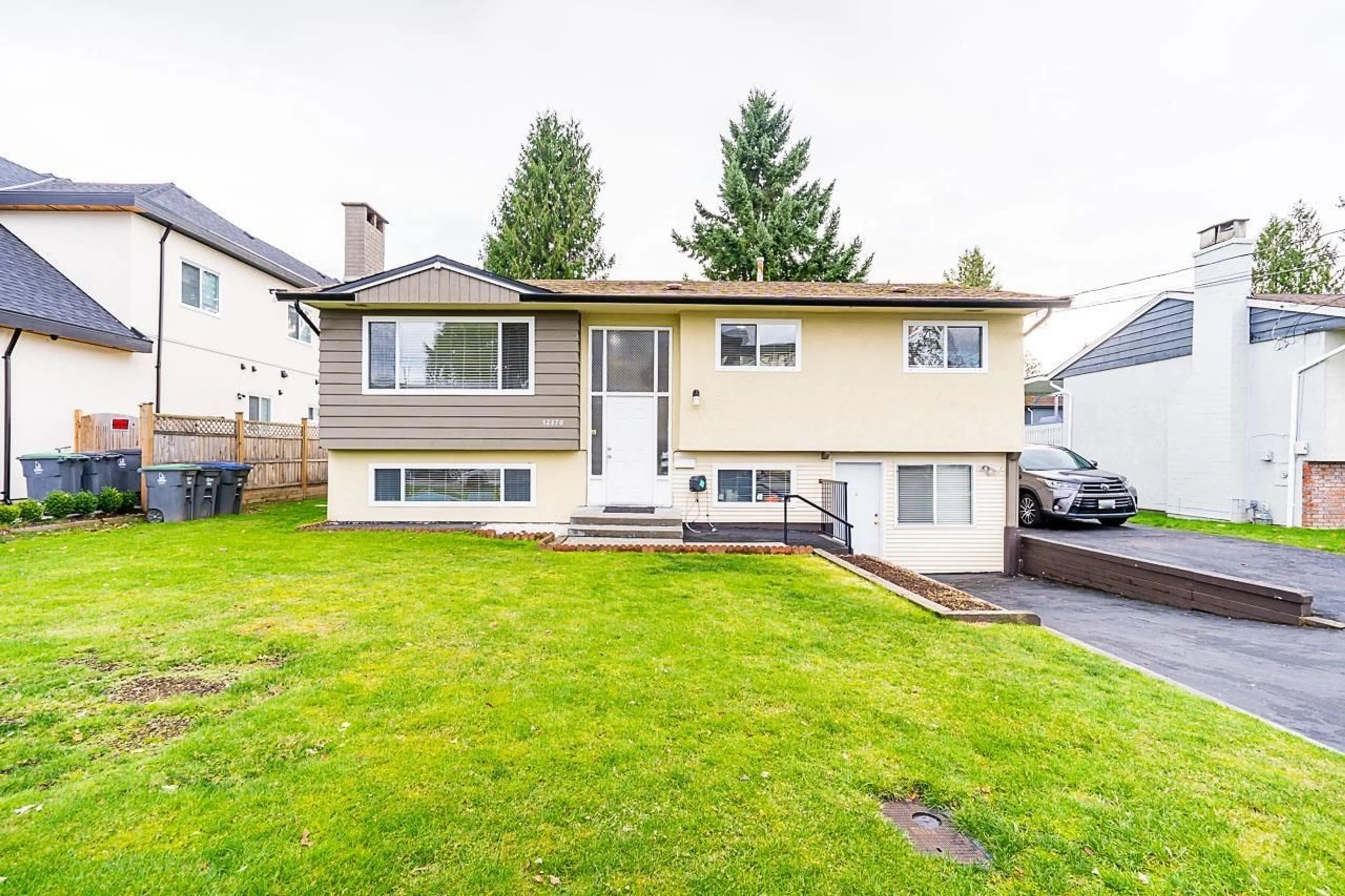 Frontside or backside of a home, the fenced backyard for 12370 95 AVENUE, Surrey British Columbia V3V1N8