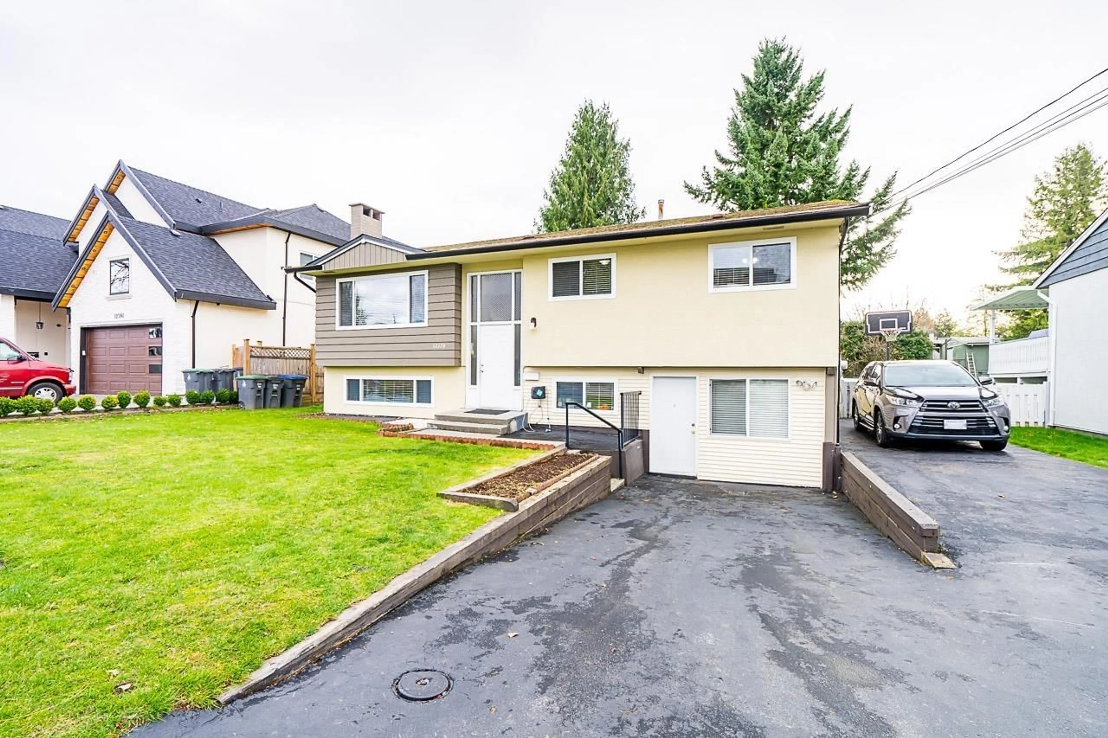 Frontside or backside of a home, the fenced backyard for 12370 95 AVENUE, Surrey British Columbia V3V1N8