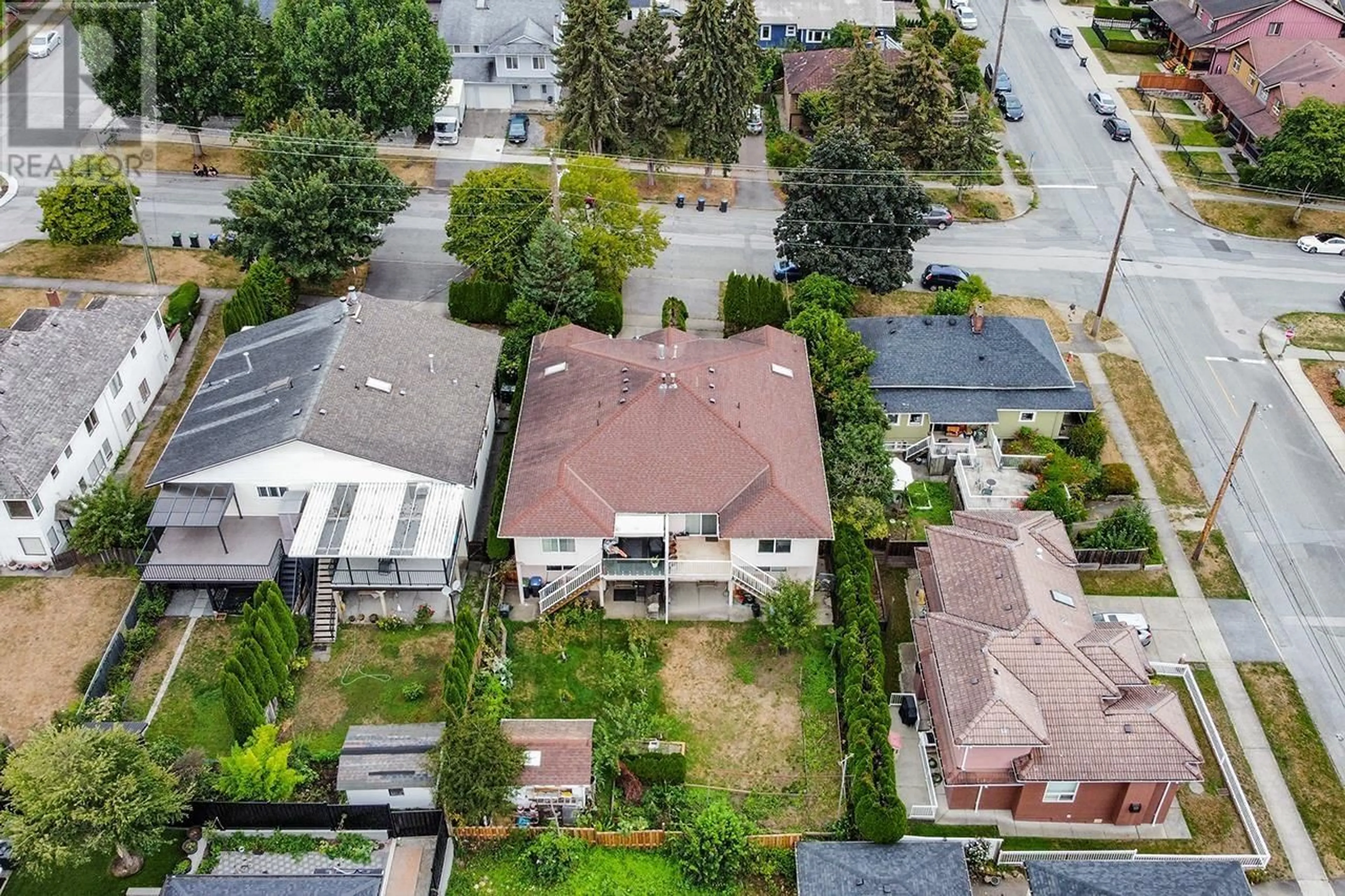 Frontside or backside of a home, the fenced backyard for 620 THIRTEENTH STREET, New Westminster British Columbia V3M4M4