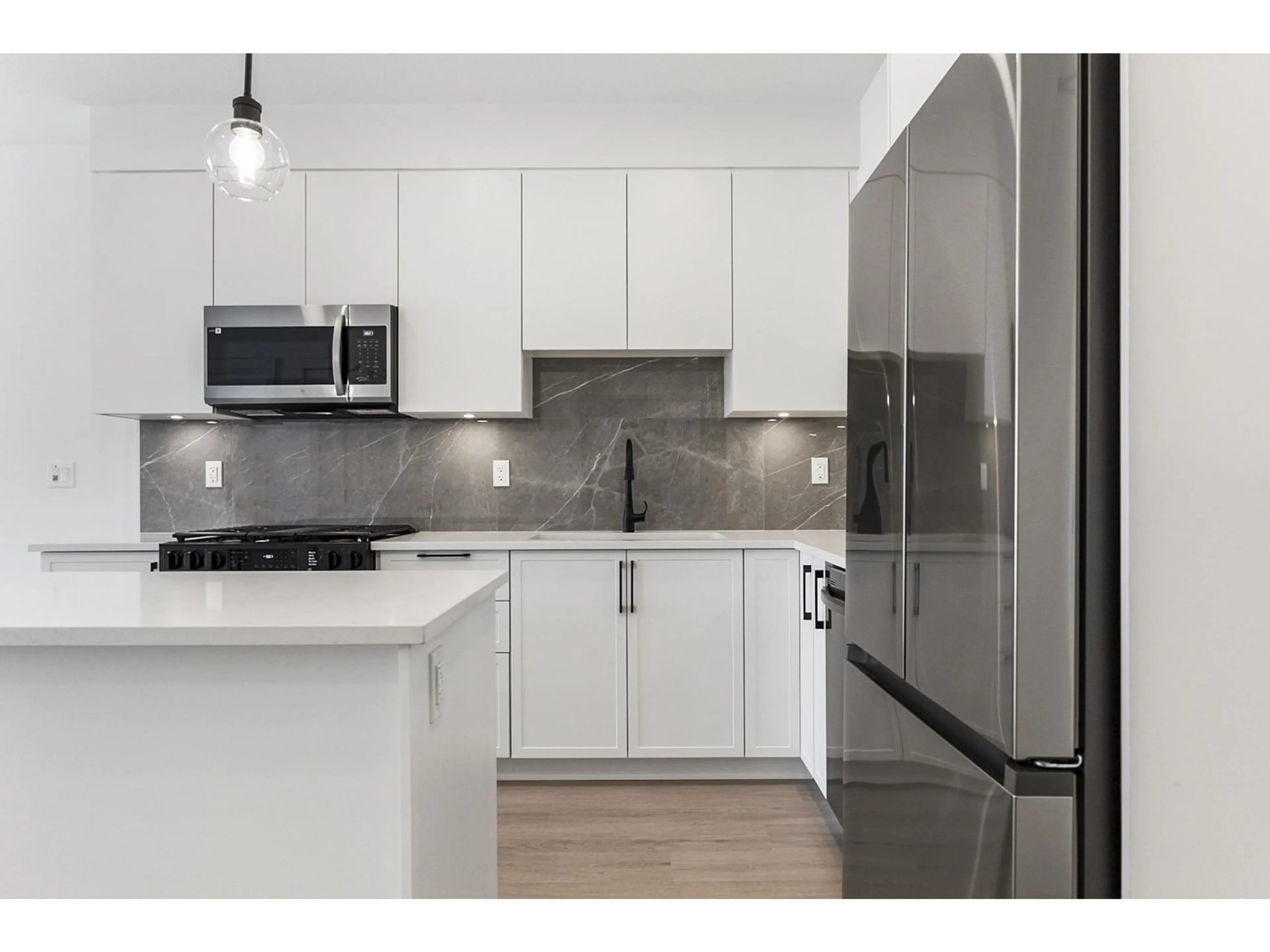 Standard kitchen, wood floors for 301 3528 146A STREET, Surrey British Columbia V4P0H4