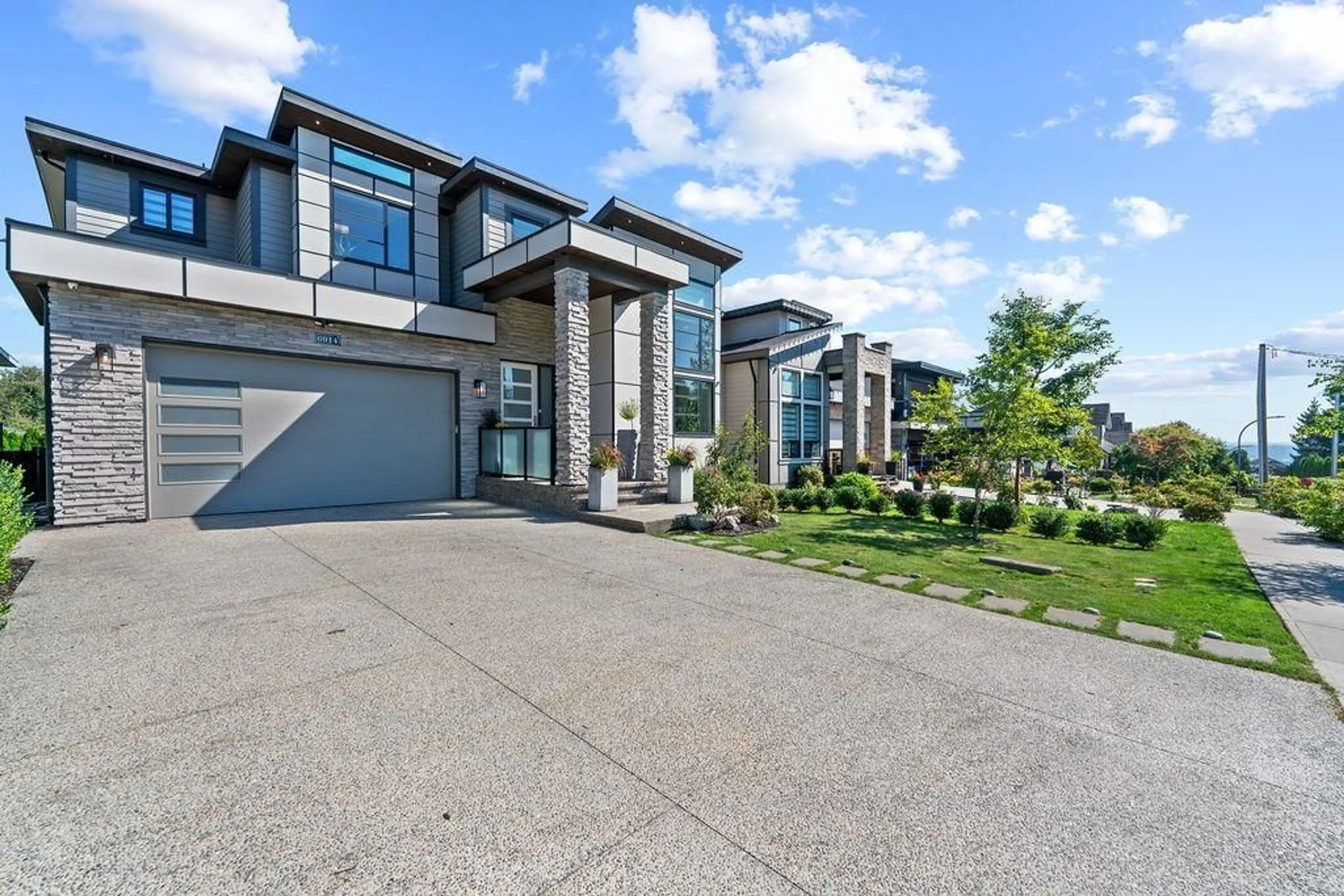 Frontside or backside of a home, the street view for 6914 205 STREET, Langley British Columbia V2Y0W4