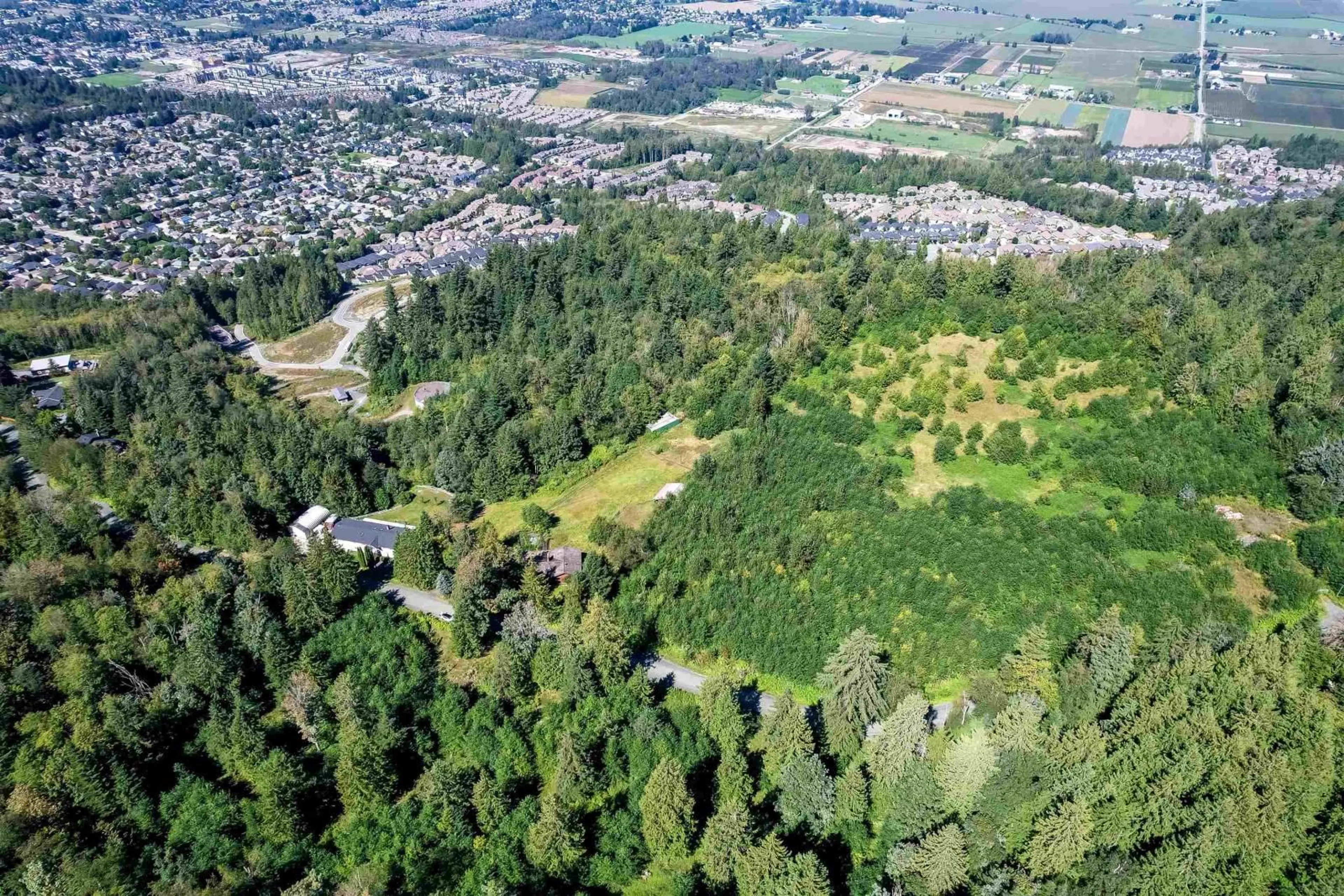A pic from outside/outdoor area/front of a property/back of a property/a pic from drone, forest/trees view for 47015 EXTROM ROAD, Chilliwack British Columbia V2R4V1
