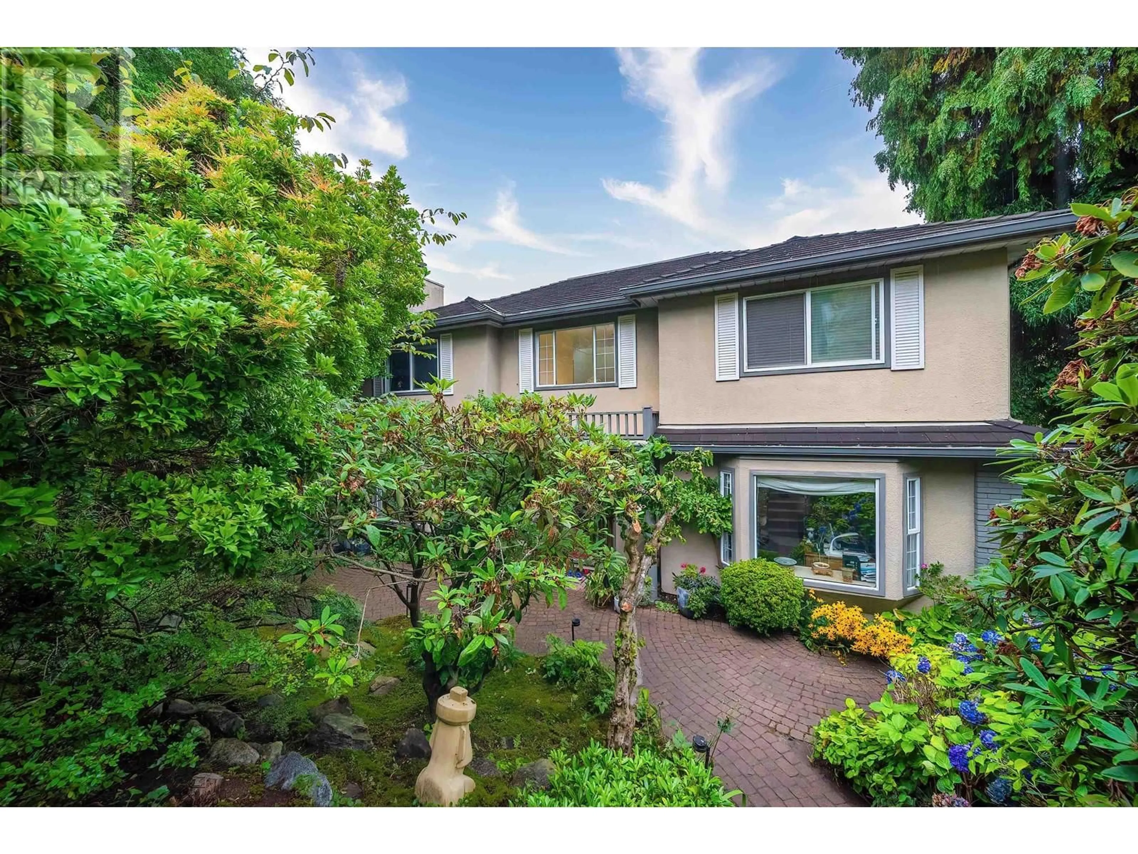 A pic from exterior of the house or condo, the fenced backyard for 4333 LOCARNO CRESCENT, Vancouver British Columbia V6R1G2