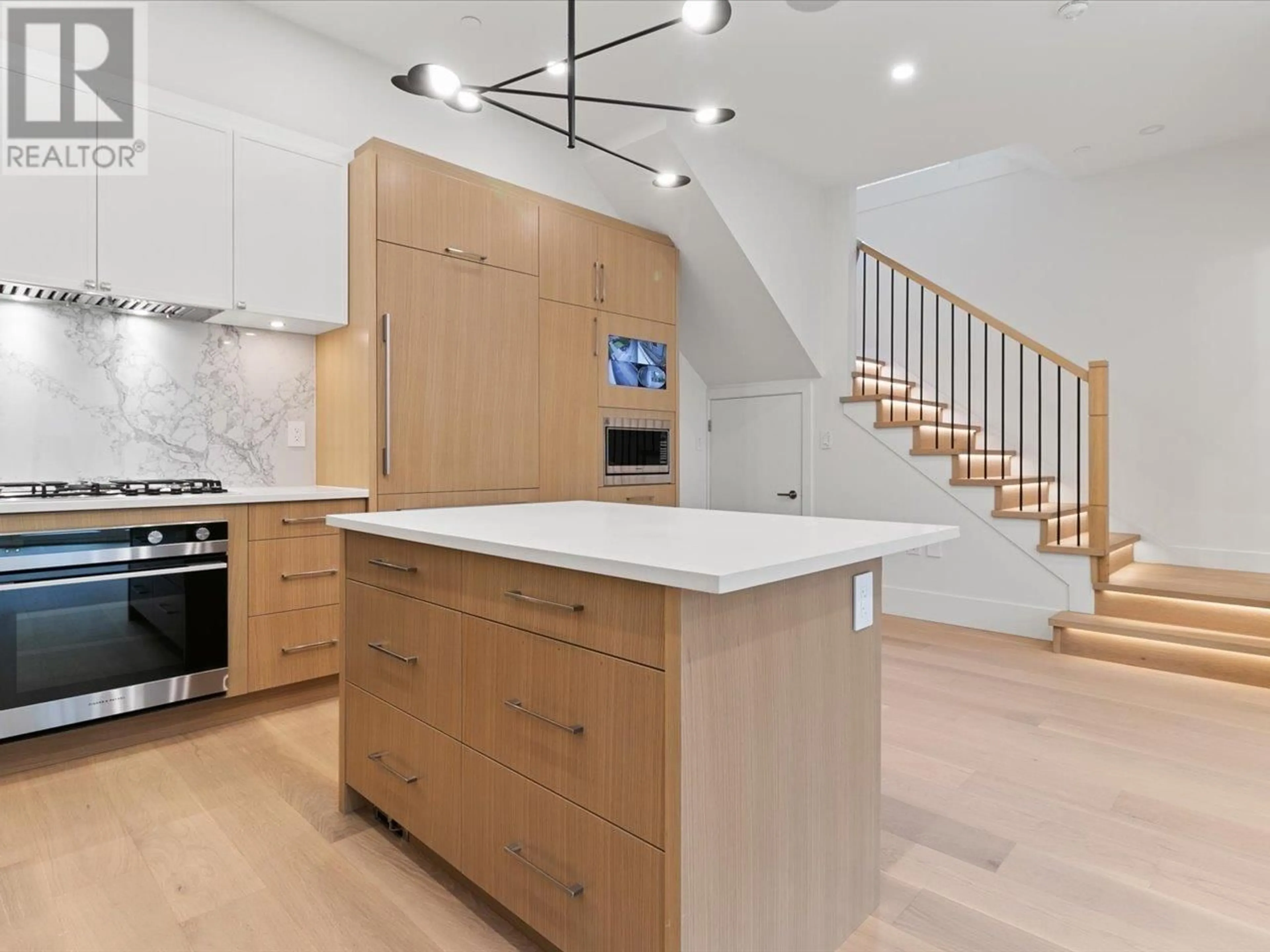 Contemporary kitchen, wood floors for 4687 W 15TH AVENUE, Vancouver British Columbia V6R3B5