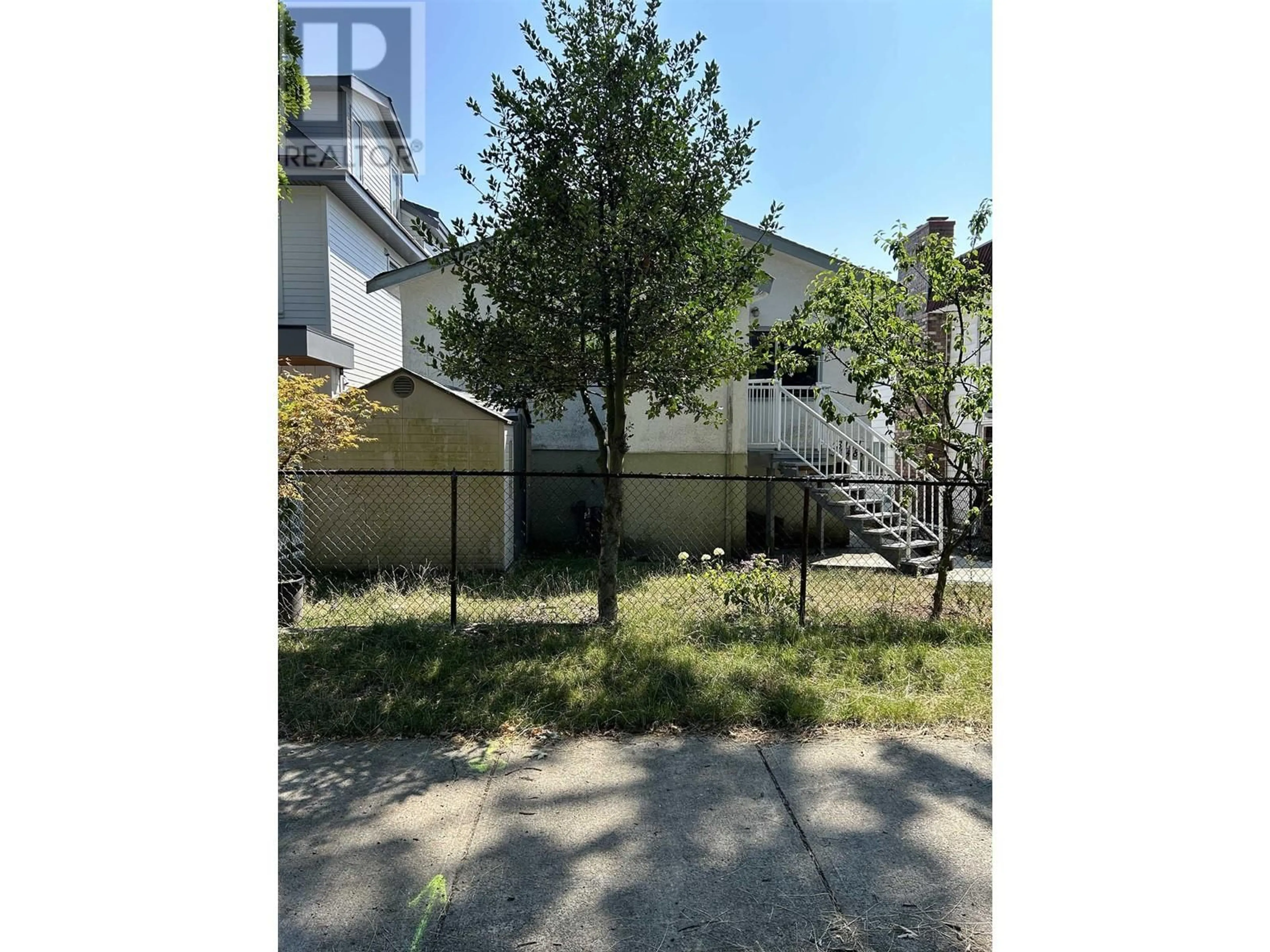 A pic from exterior of the house or condo, the fenced backyard for 3484 FRANKLIN STREET, Vancouver British Columbia V5K1Y3