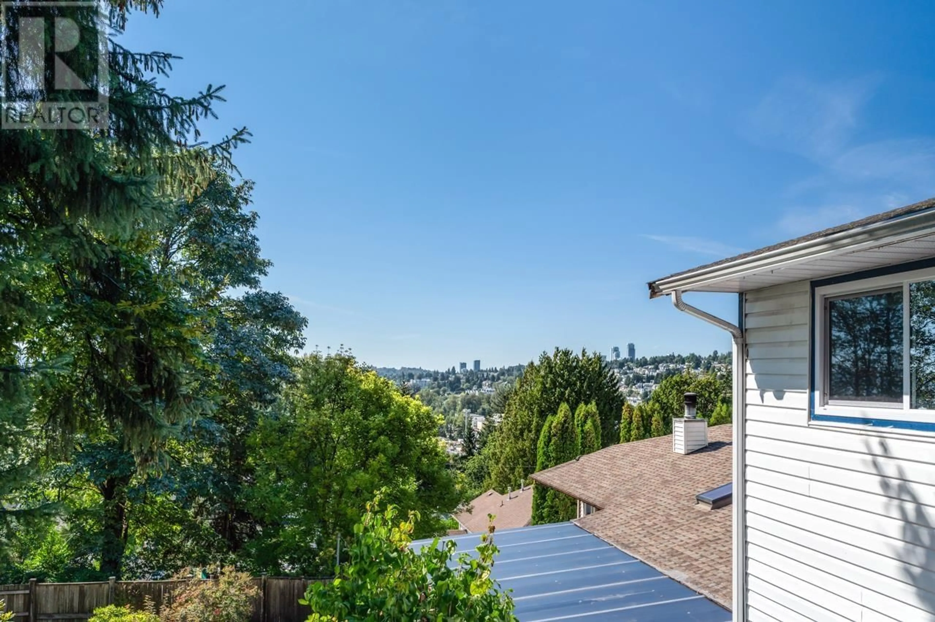 A pic from exterior of the house or condo, the fenced backyard for 1984 DAWES HILL ROAD, Coquitlam British Columbia V3K1M6