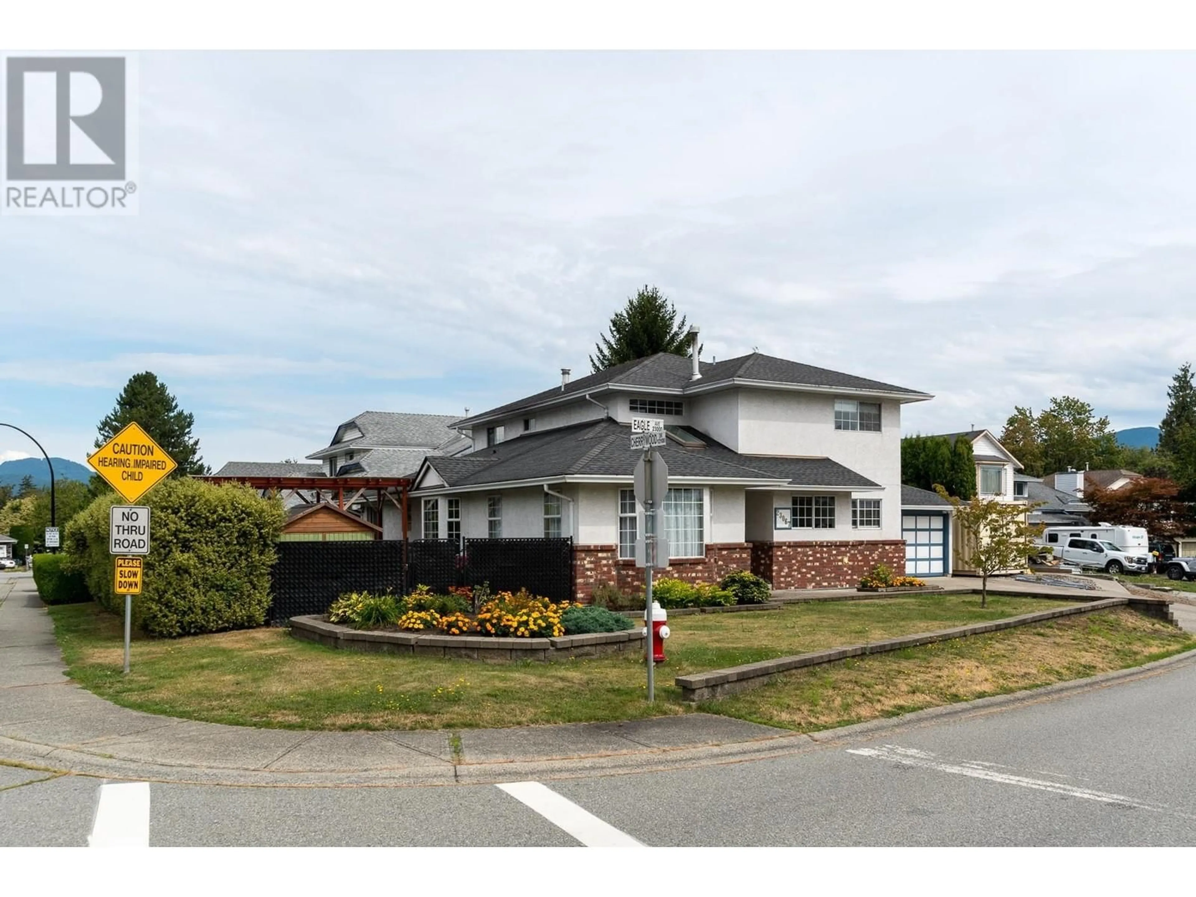 Frontside or backside of a home, the street view for 23067 EAGLE AVENUE, Maple Ridge British Columbia V2X0B5