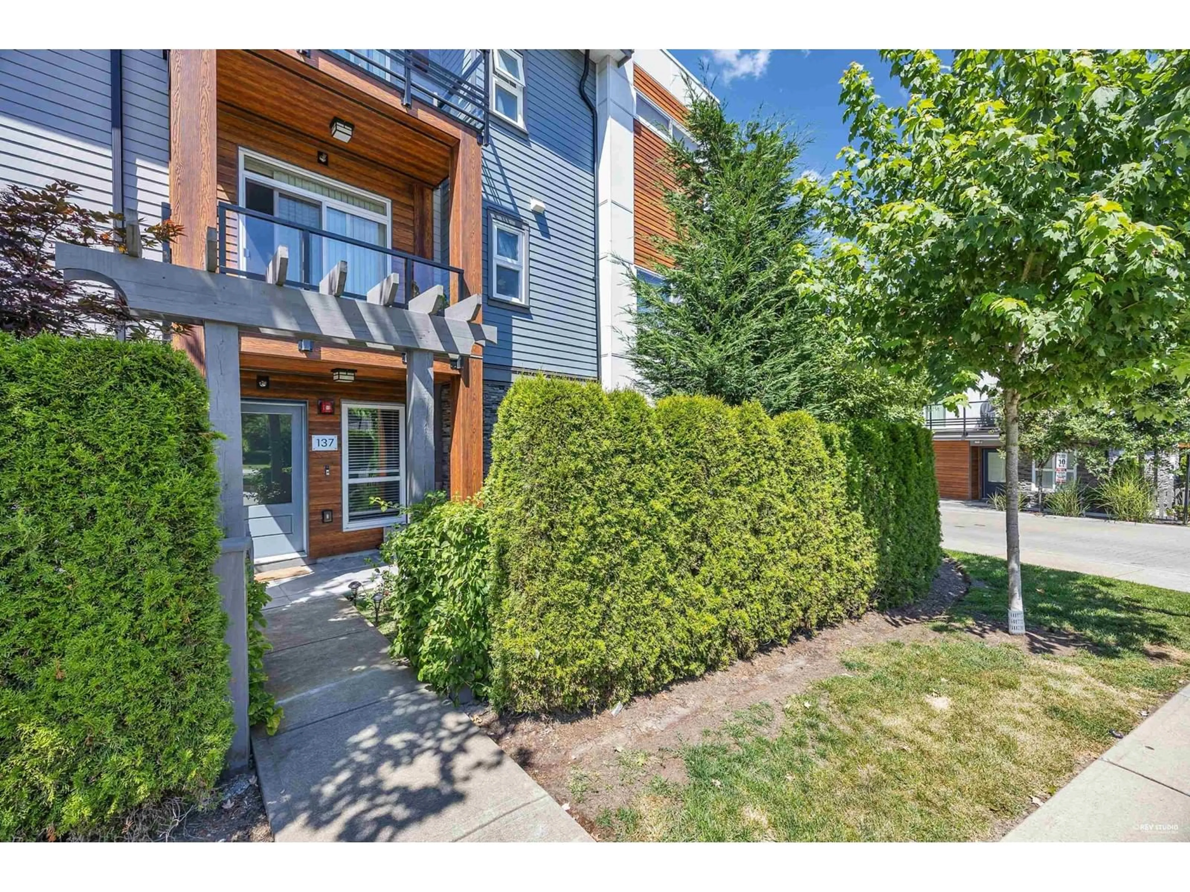 A pic from exterior of the house or condo, the fenced backyard for 137 7947 209 STREET, Langley British Columbia V2Y0Y6