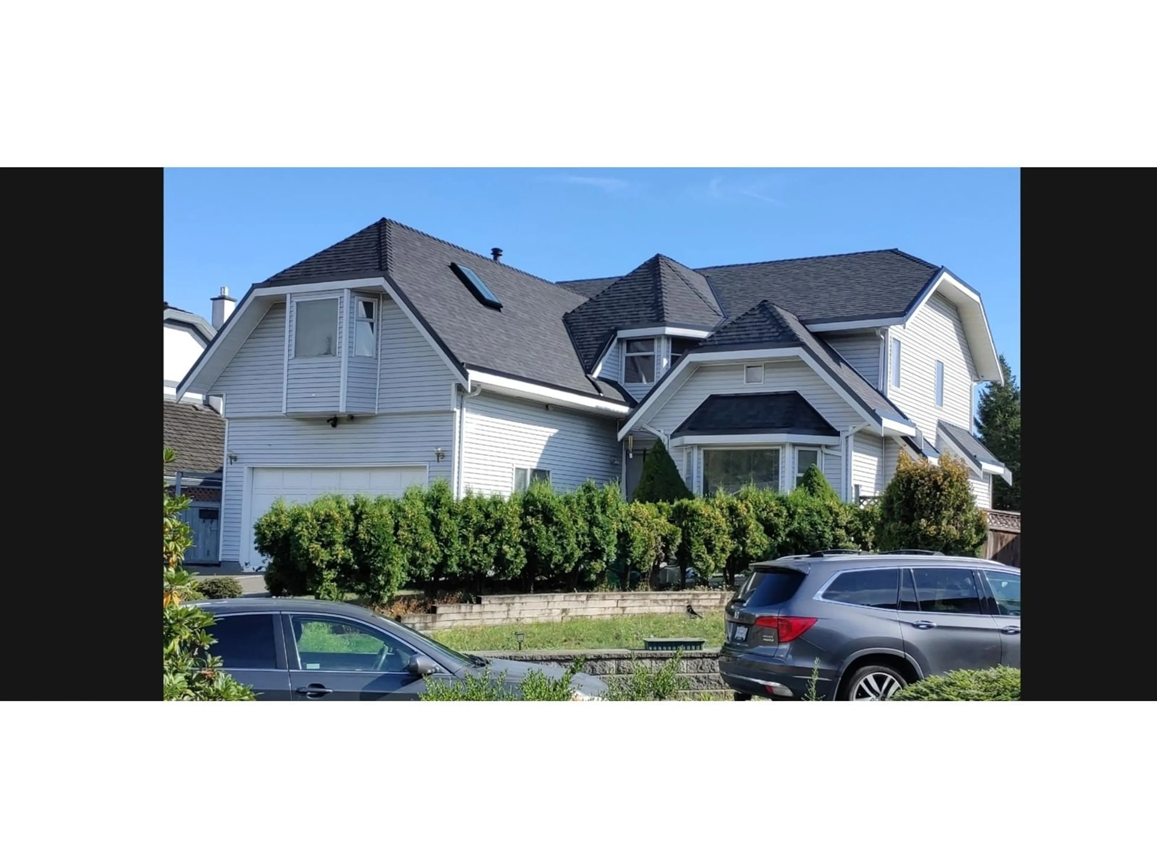 Home with vinyl exterior material, street for 12978 96A, Surrey British Columbia V3T5K5