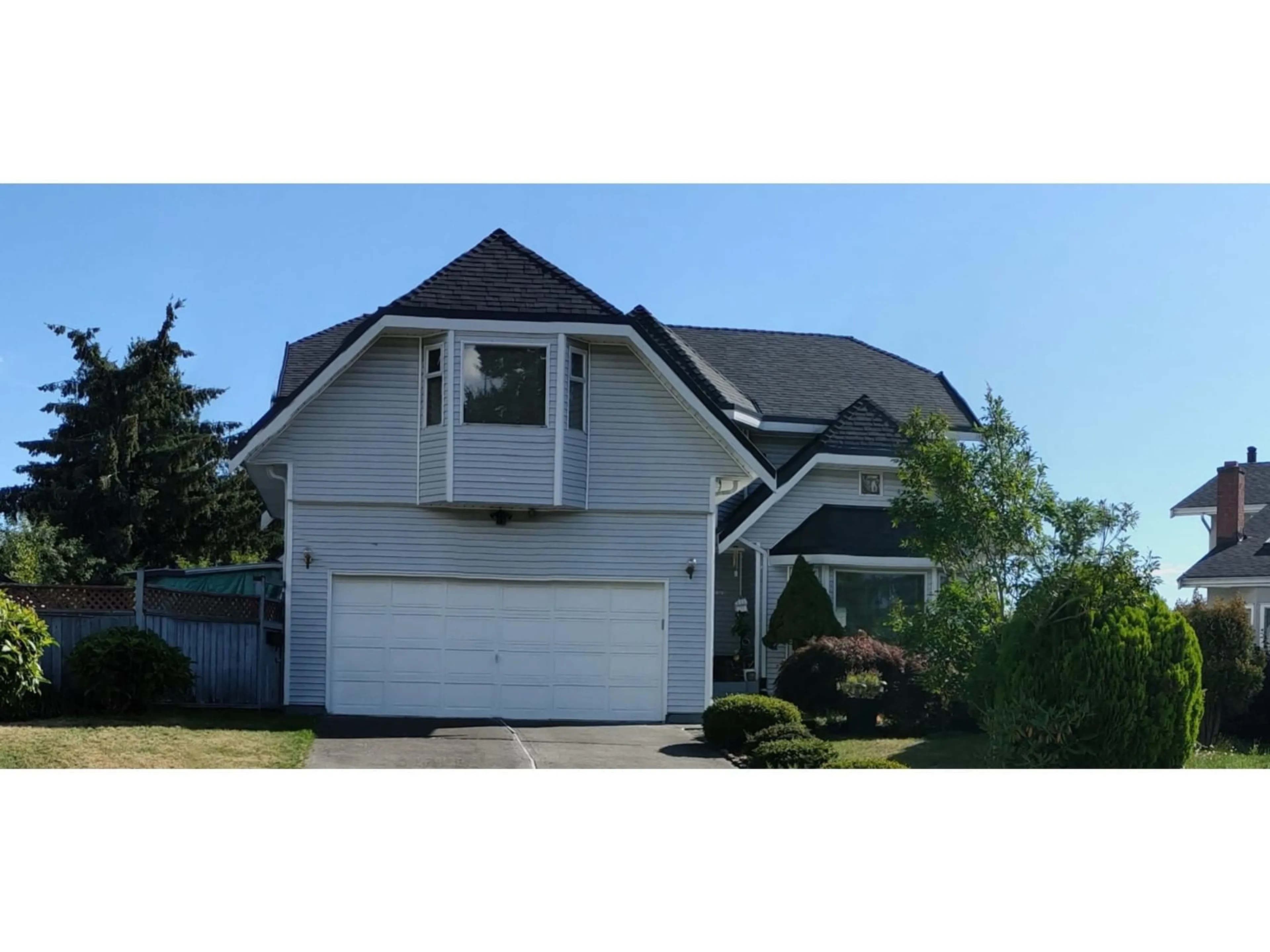 Home with vinyl exterior material, street for 12978 96A, Surrey British Columbia V3T5K5