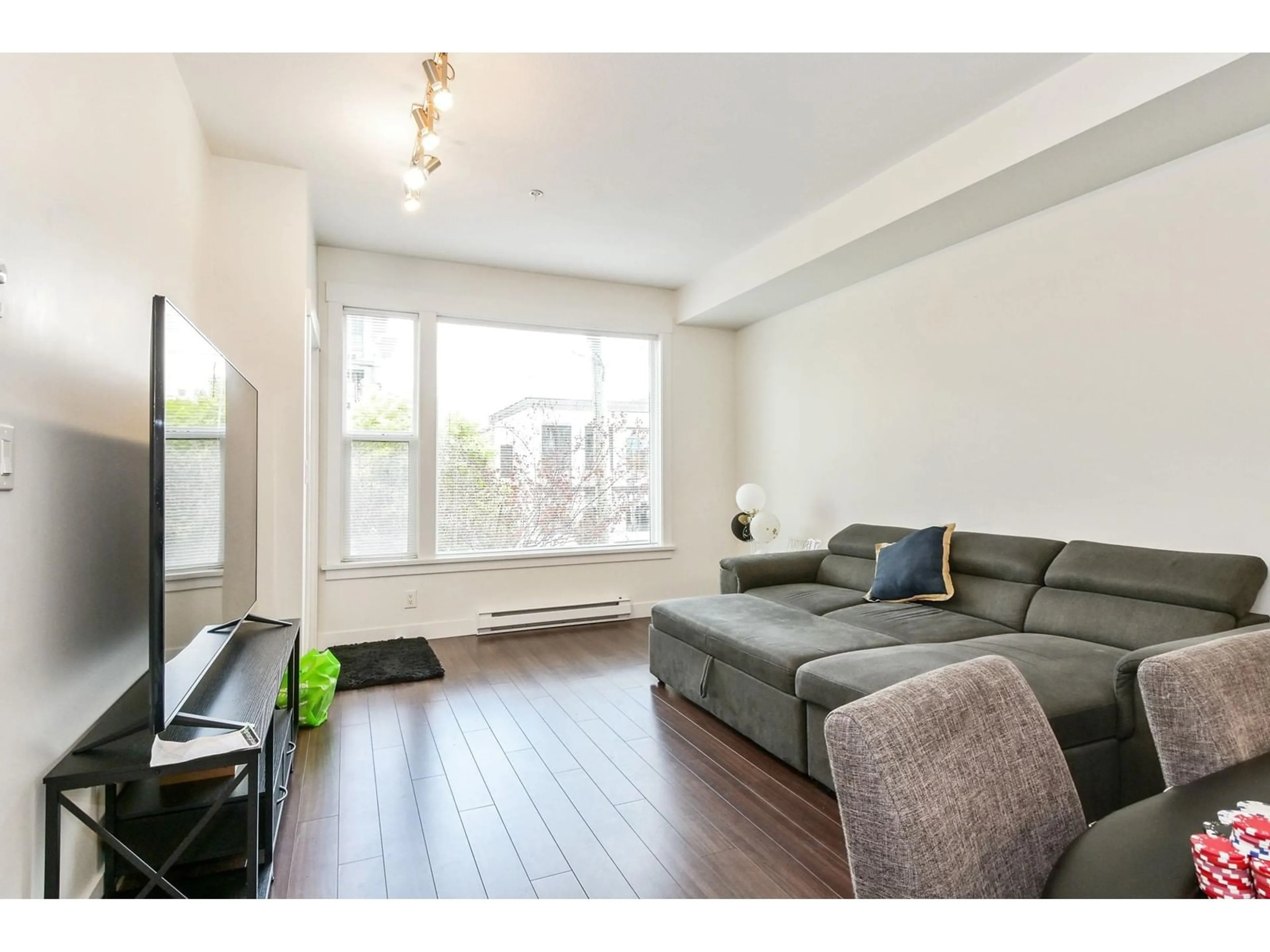 Living room, wood floors for 208 33538 MARSHALL ROAD, Abbotsford British Columbia V2S0C7