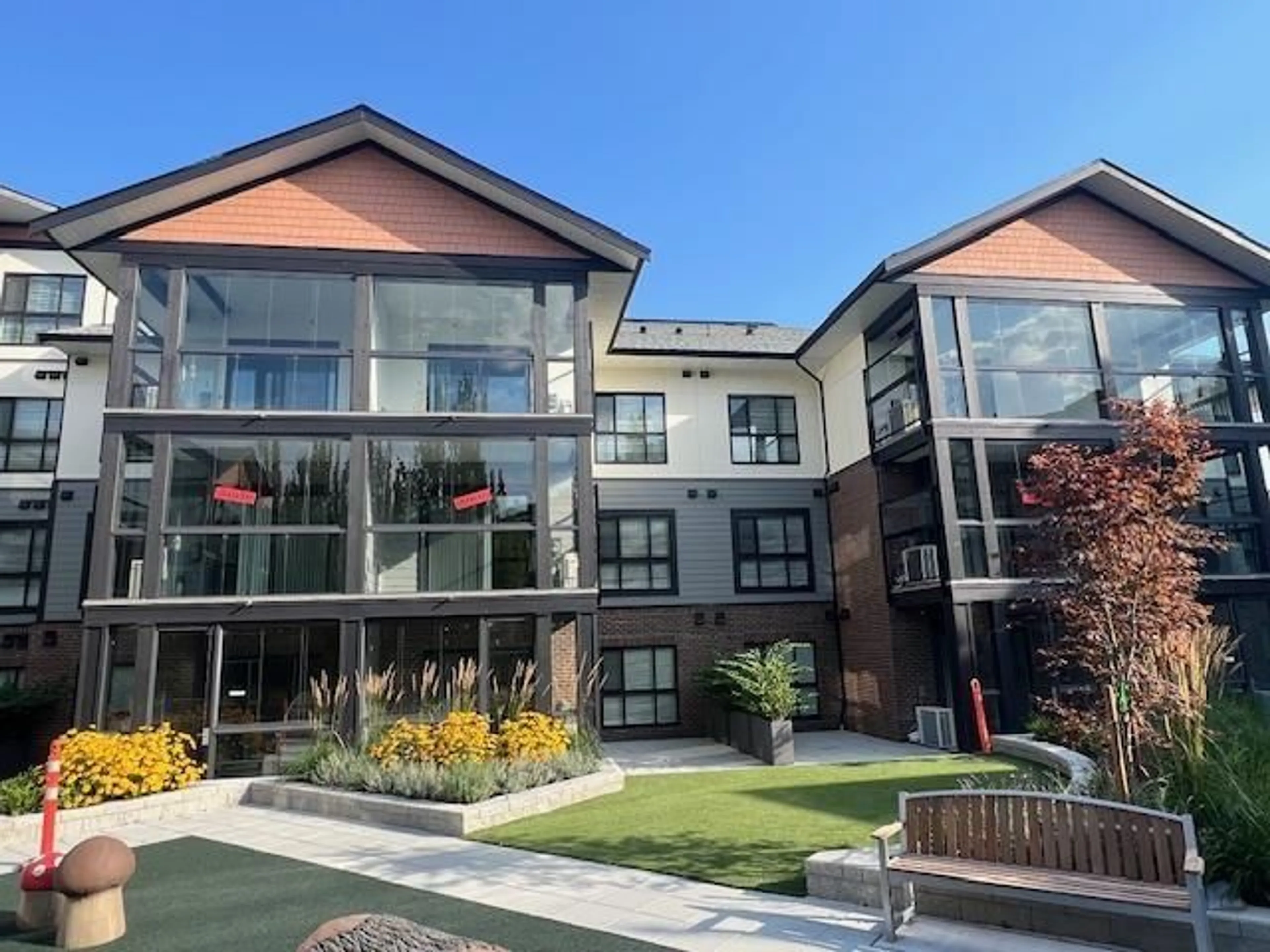 A pic from exterior of the house or condo, the front or back of building for 213 8497 YOUNG ROAD|Chilliwack Proper So, Chilliwack British Columbia V2P0M6