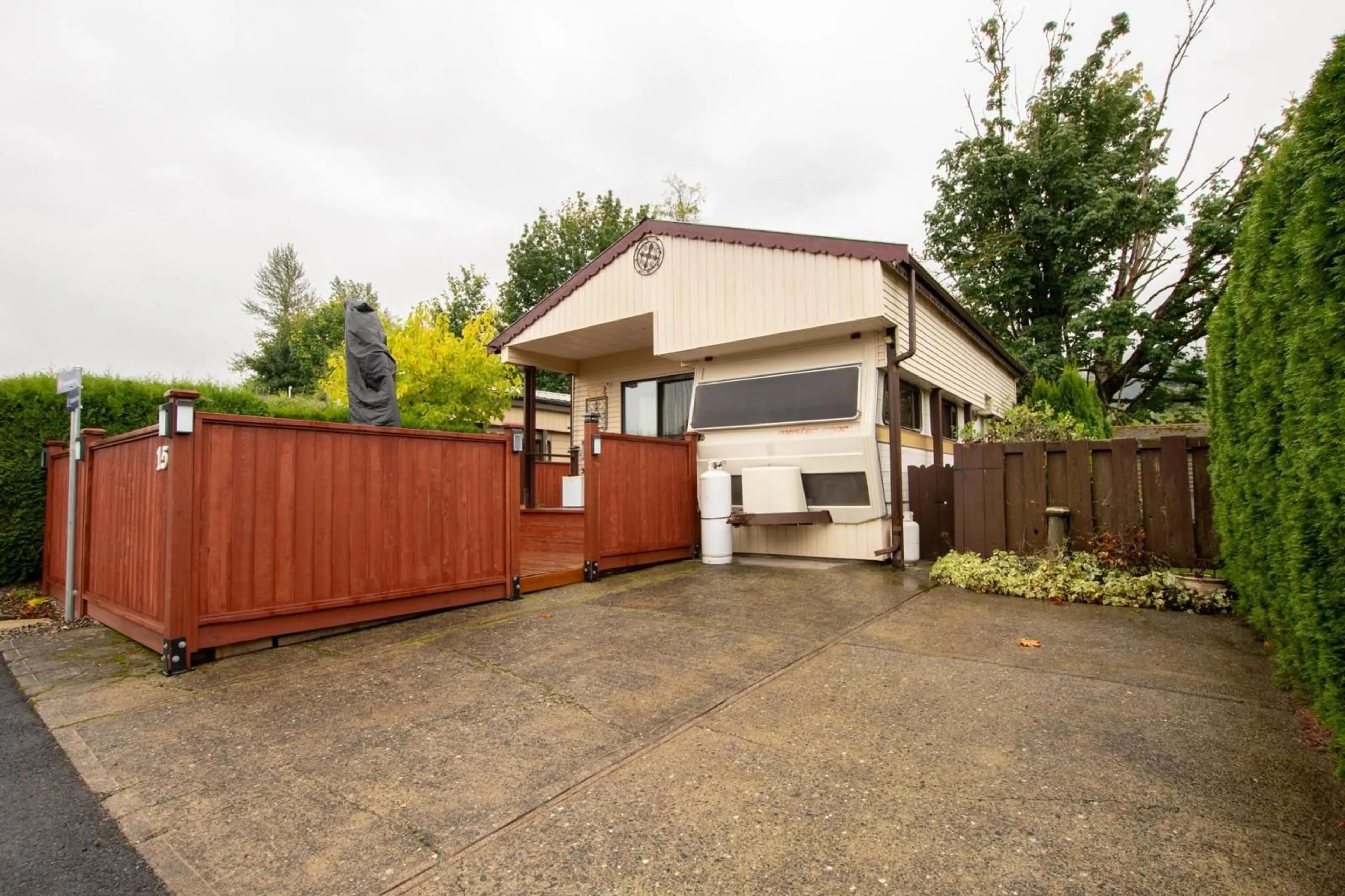 Frontside or backside of a home, the fenced backyard for 15 1436 FROST ROAD|Columbia Valley, Chilliwack British Columbia V2R4X8