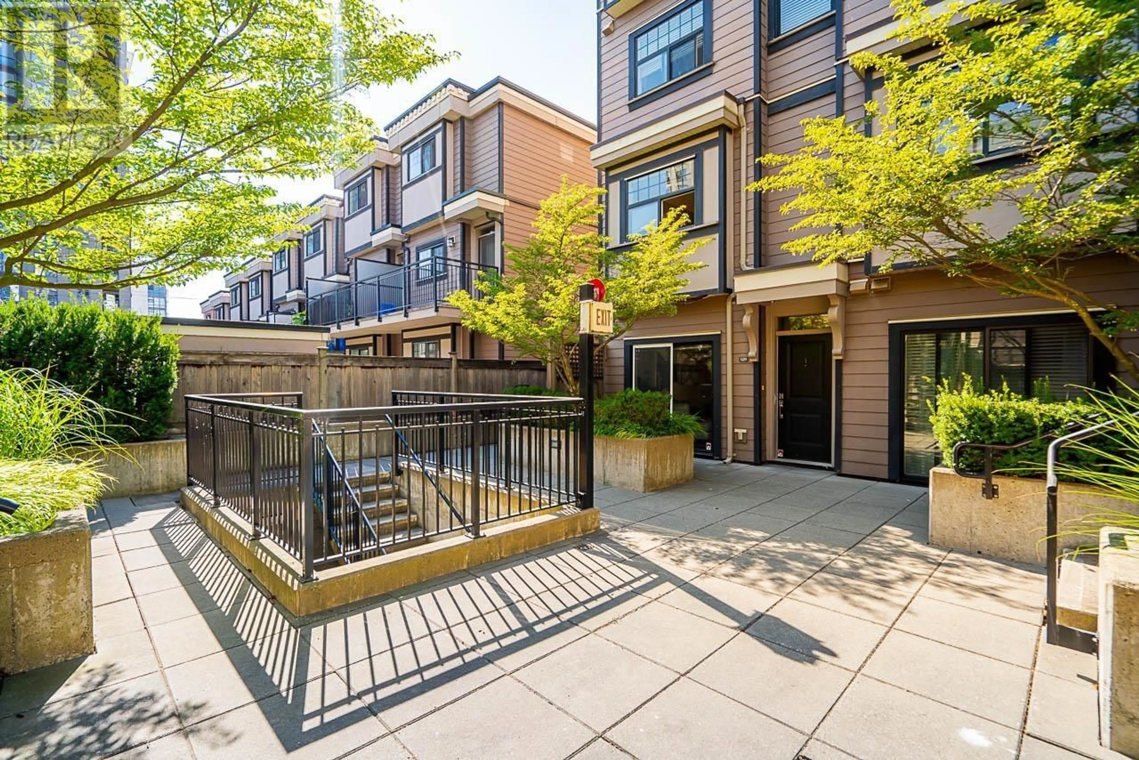 A pic from exterior of the house or condo, the fenced backyard for 109 828 ROYAL AVENUE, New Westminster British Columbia V3M1J9