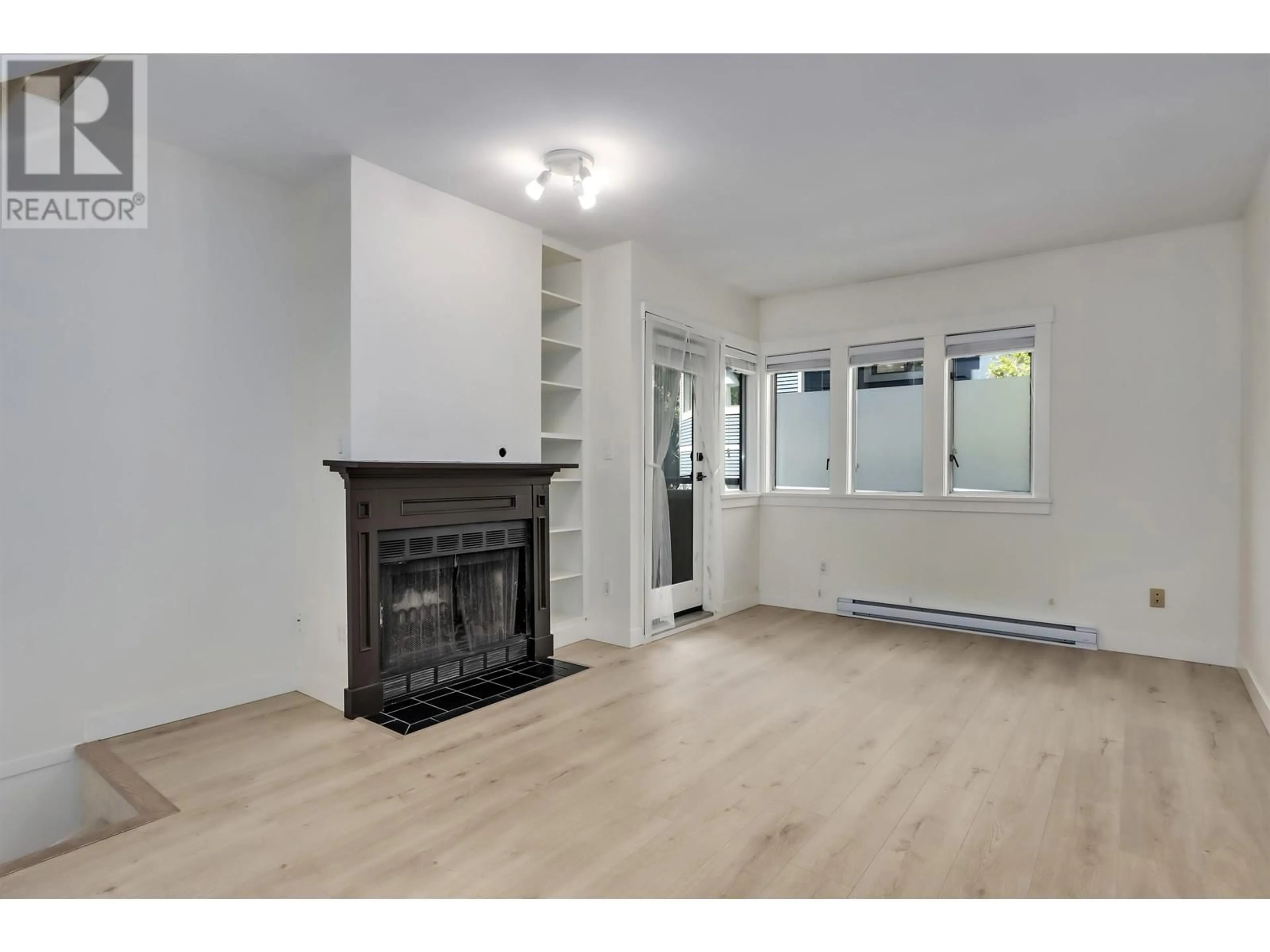 A pic of a room, wood floors for 2415 W 6TH AVENUE, Vancouver British Columbia V6K1W2