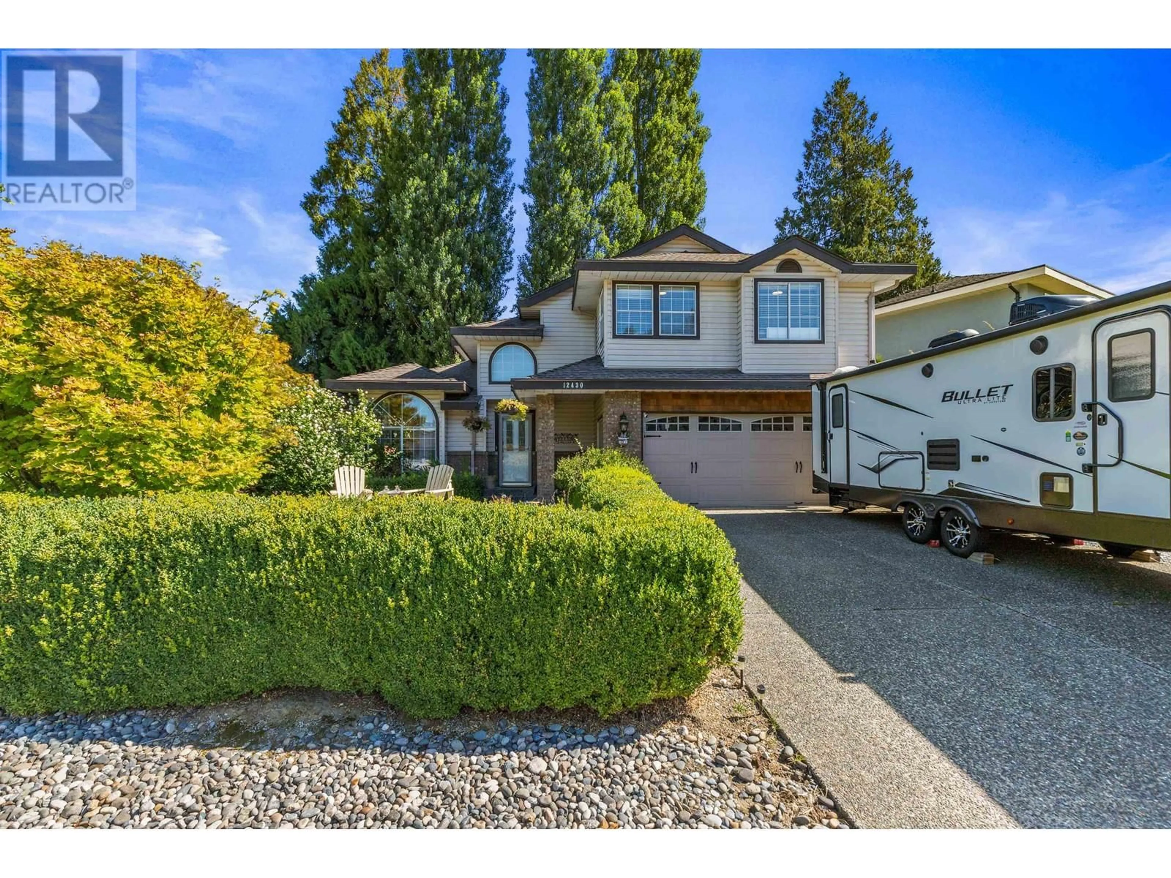 Frontside or backside of a home, the street view for 12430 205 STREET, Maple Ridge British Columbia V2X0L9