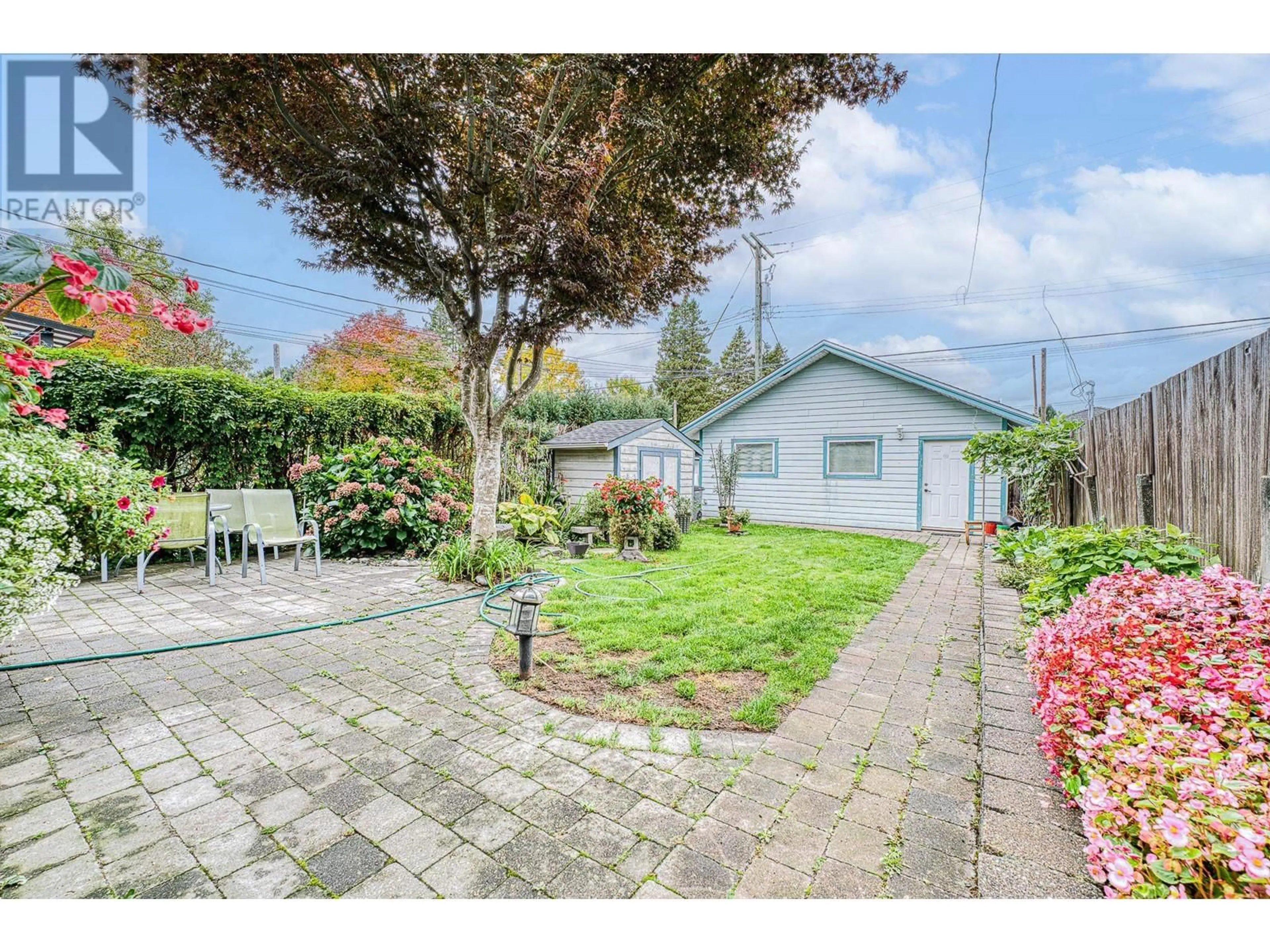 Frontside or backside of a home, the fenced backyard for 2779 NANAIMO STREET, Vancouver British Columbia V5N5E9