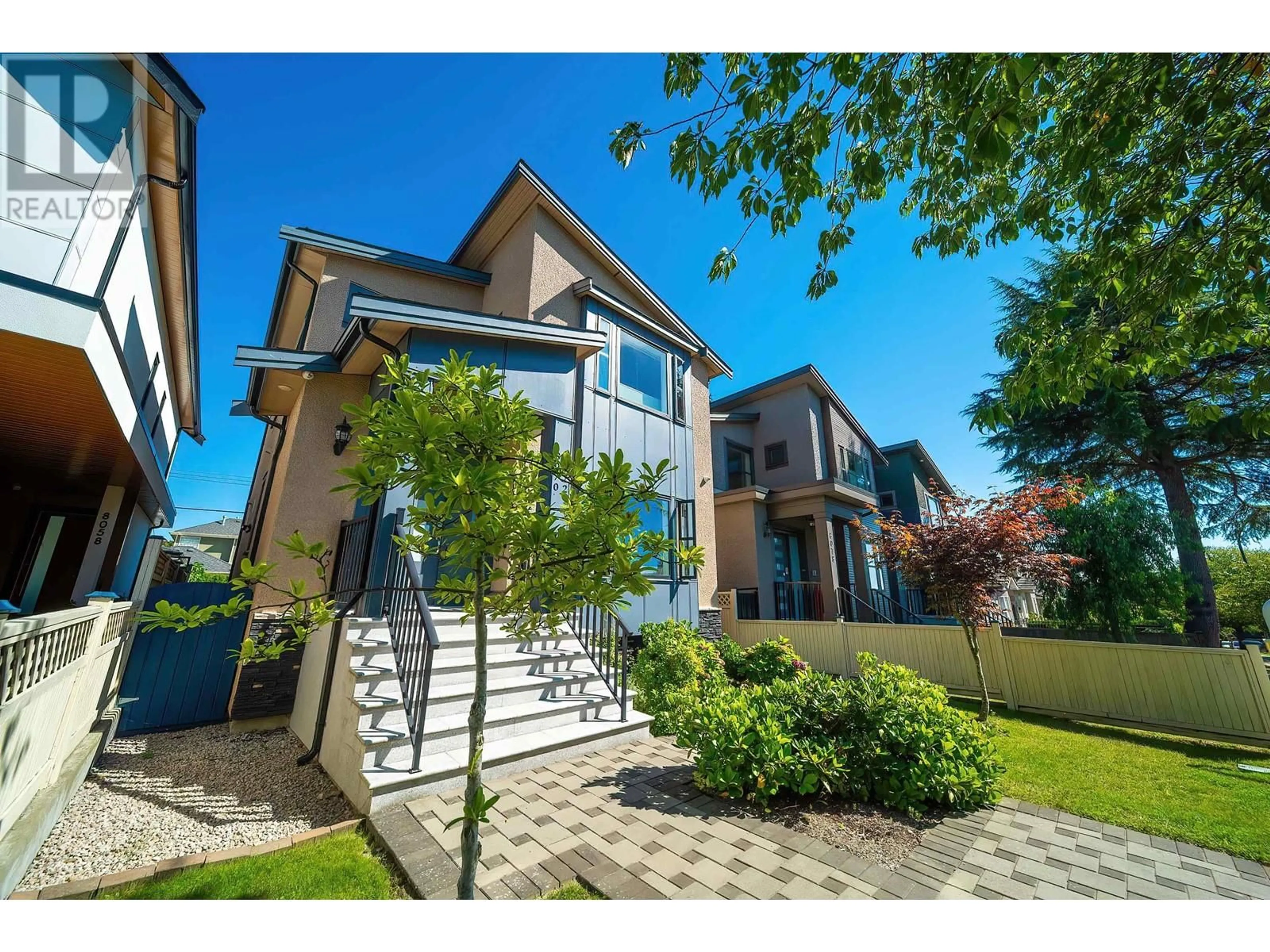 Frontside or backside of a home, the fenced backyard for 8068 HAIG STREET, Vancouver British Columbia V6P4R9