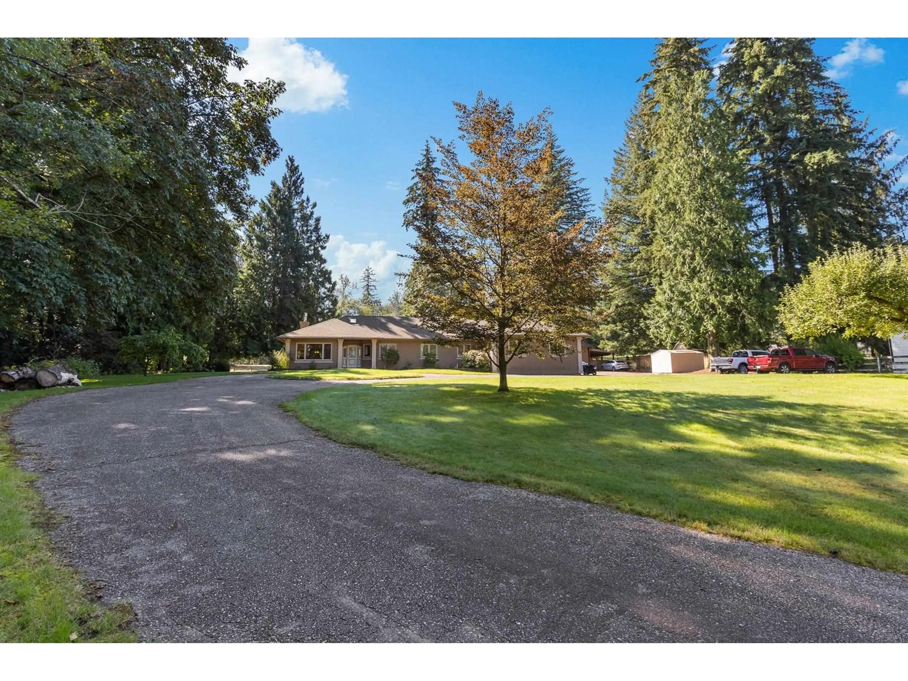 Frontside or backside of a home, the fenced backyard for 26210 84 AVENUE, Langley British Columbia V1M3M6