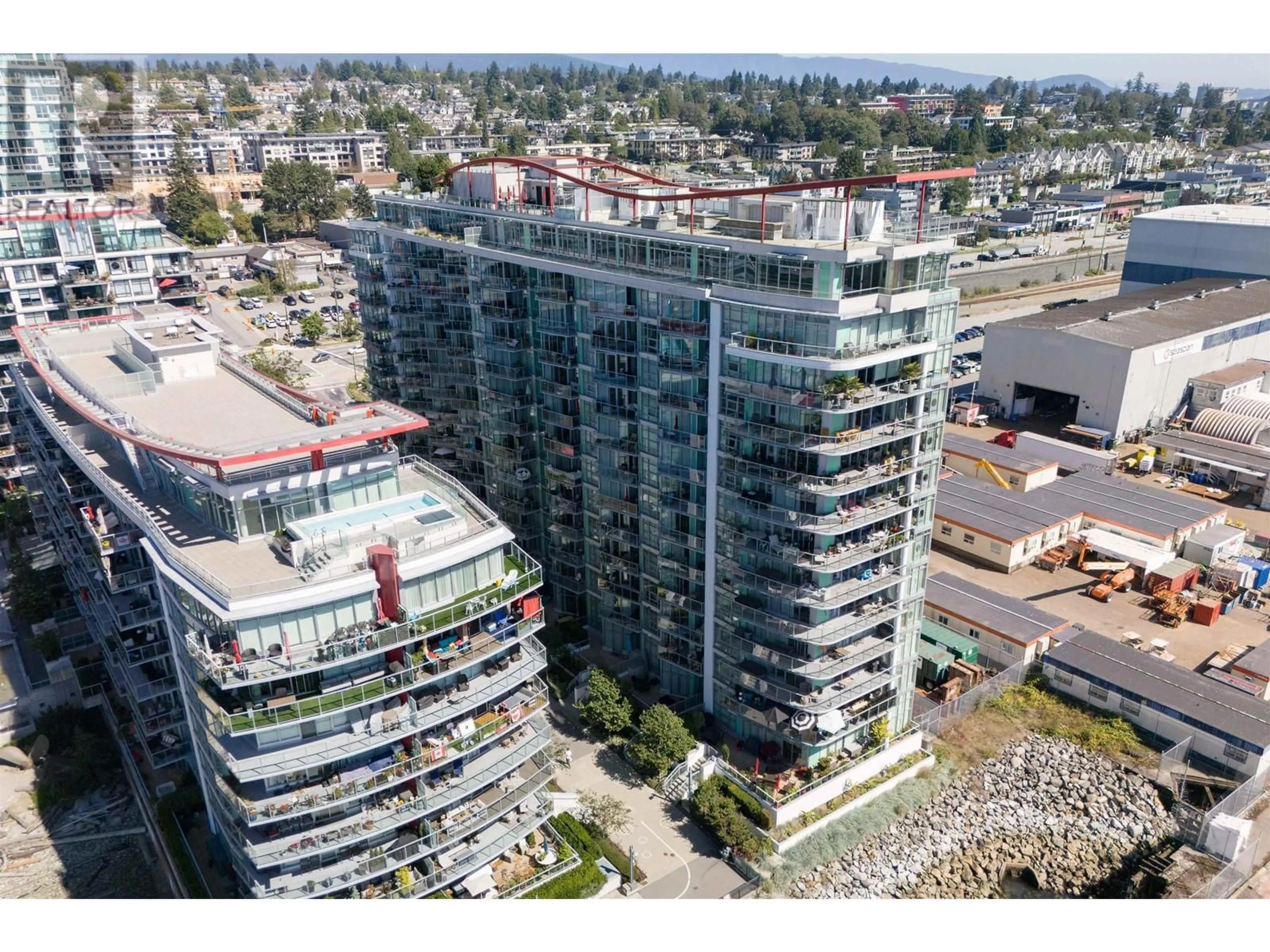 A pic from exterior of the house or condo, the view of city buildings for 209 199 VICTORY SHIP WAY, North Vancouver British Columbia V9L0E2