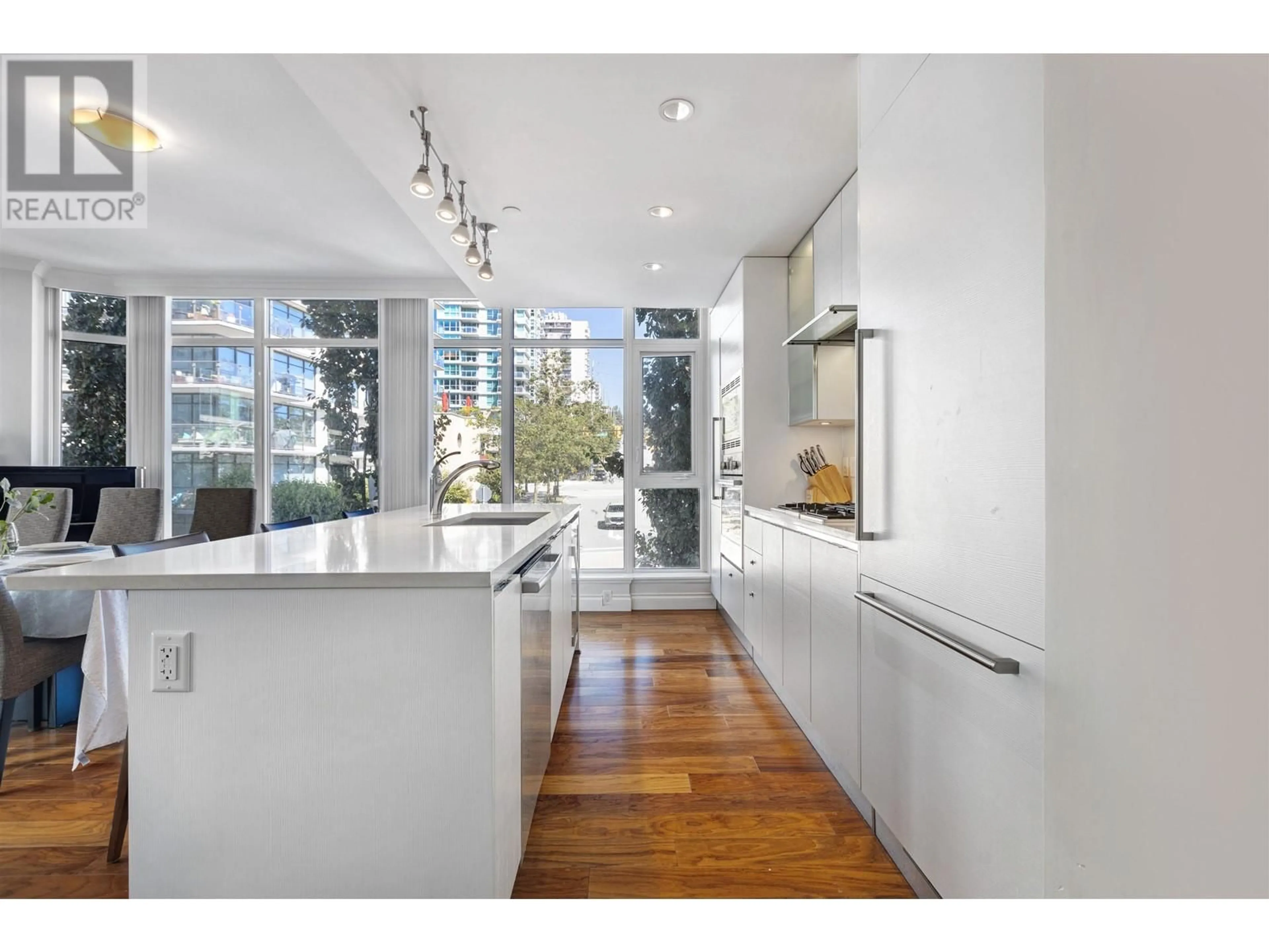 Contemporary kitchen, wood floors for 209 199 VICTORY SHIP WAY, North Vancouver British Columbia V9L0E2