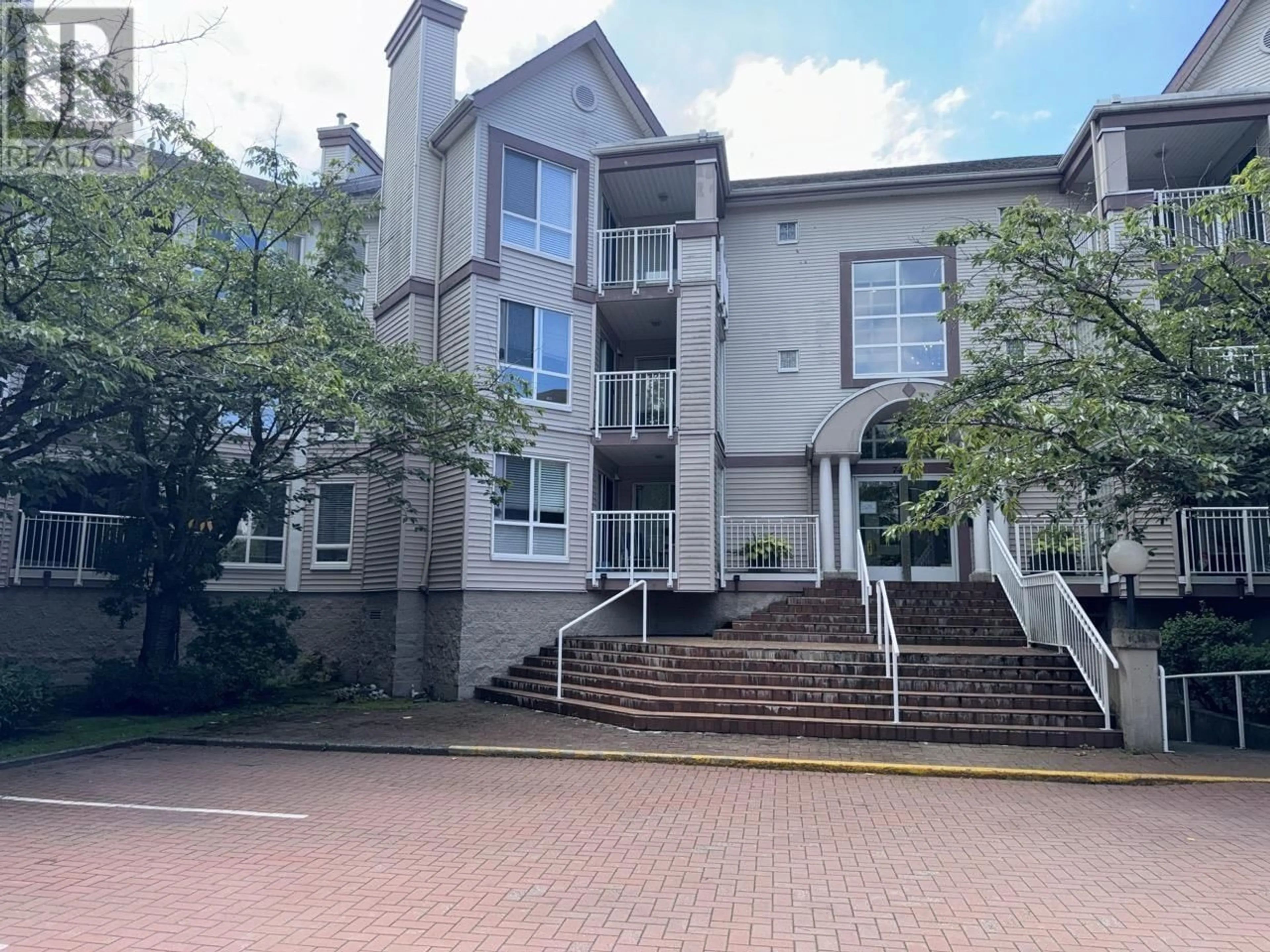 A pic from exterior of the house or condo, the front or back of building for 111 7453 MOFFATT ROAD, Richmond British Columbia V6Y3W1