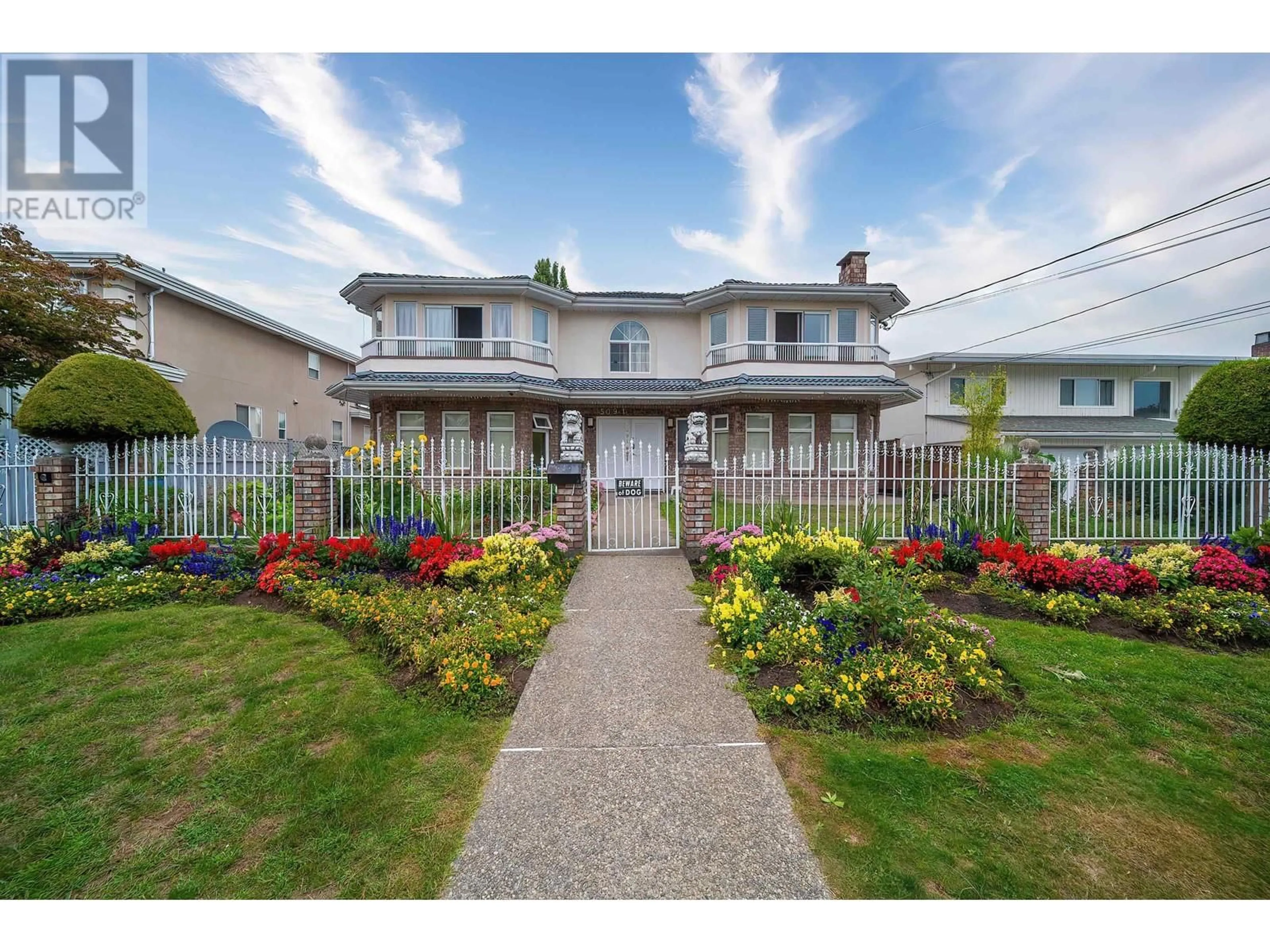 A pic from exterior of the house or condo, the fenced backyard for 5091 SIDLEY STREET, Burnaby British Columbia V5J1T6