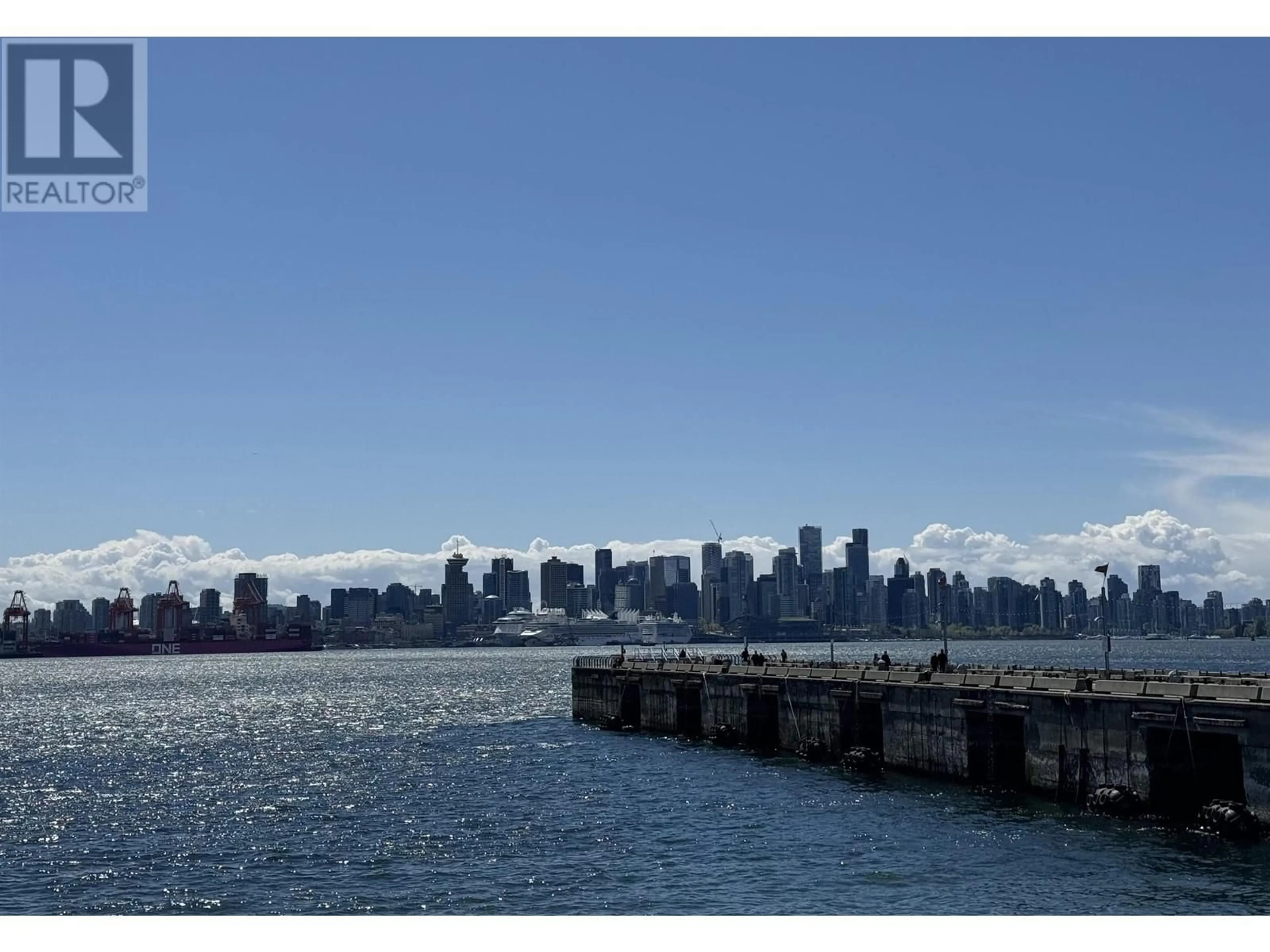 A pic from exterior of the house or condo, the view of city buildings for 105 175 VICTORY SHIP WAY, North Vancouver British Columbia V7L0G1