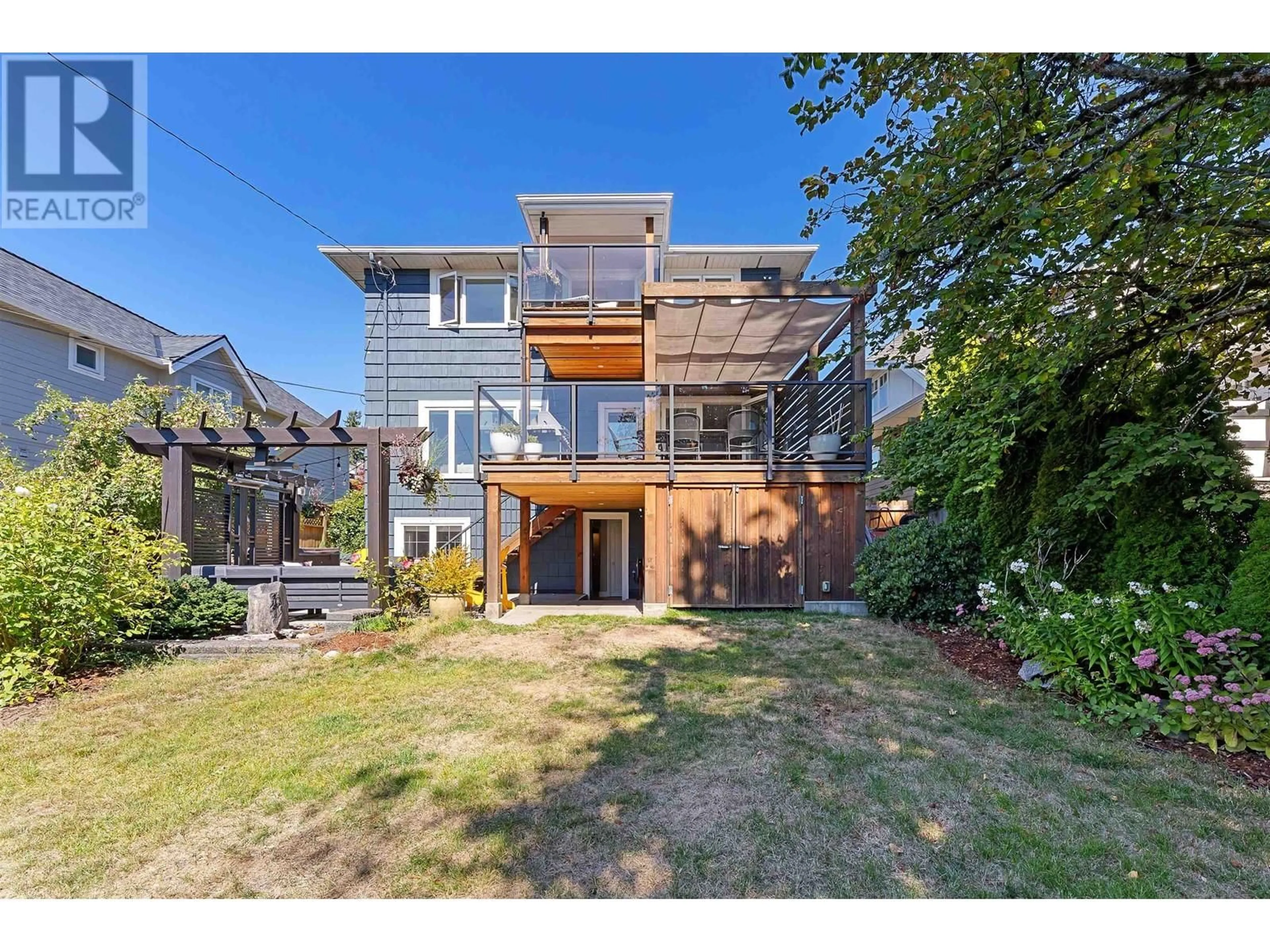 Frontside or backside of a home, the fenced backyard for 747 E 6TH STREET, North Vancouver British Columbia V7L1R5