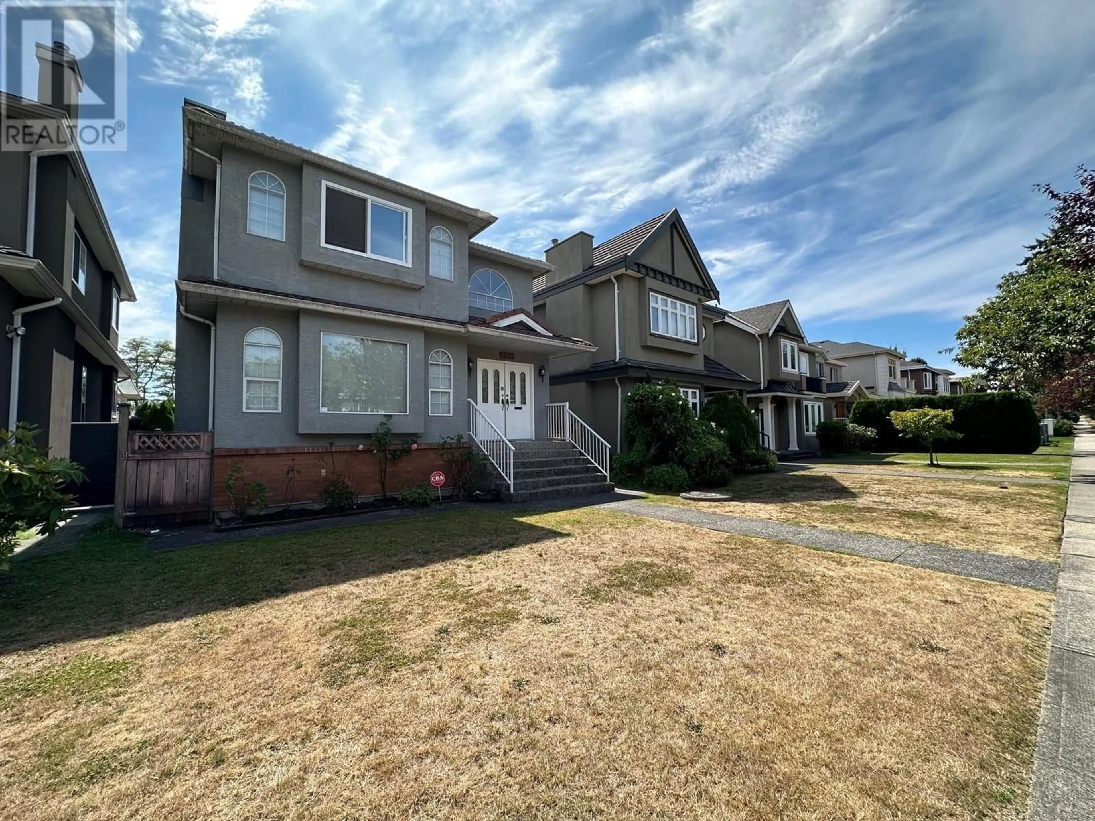 Frontside or backside of a home, the fenced backyard for 128 W 48TH AVENUE, Vancouver British Columbia V5Y2Y7