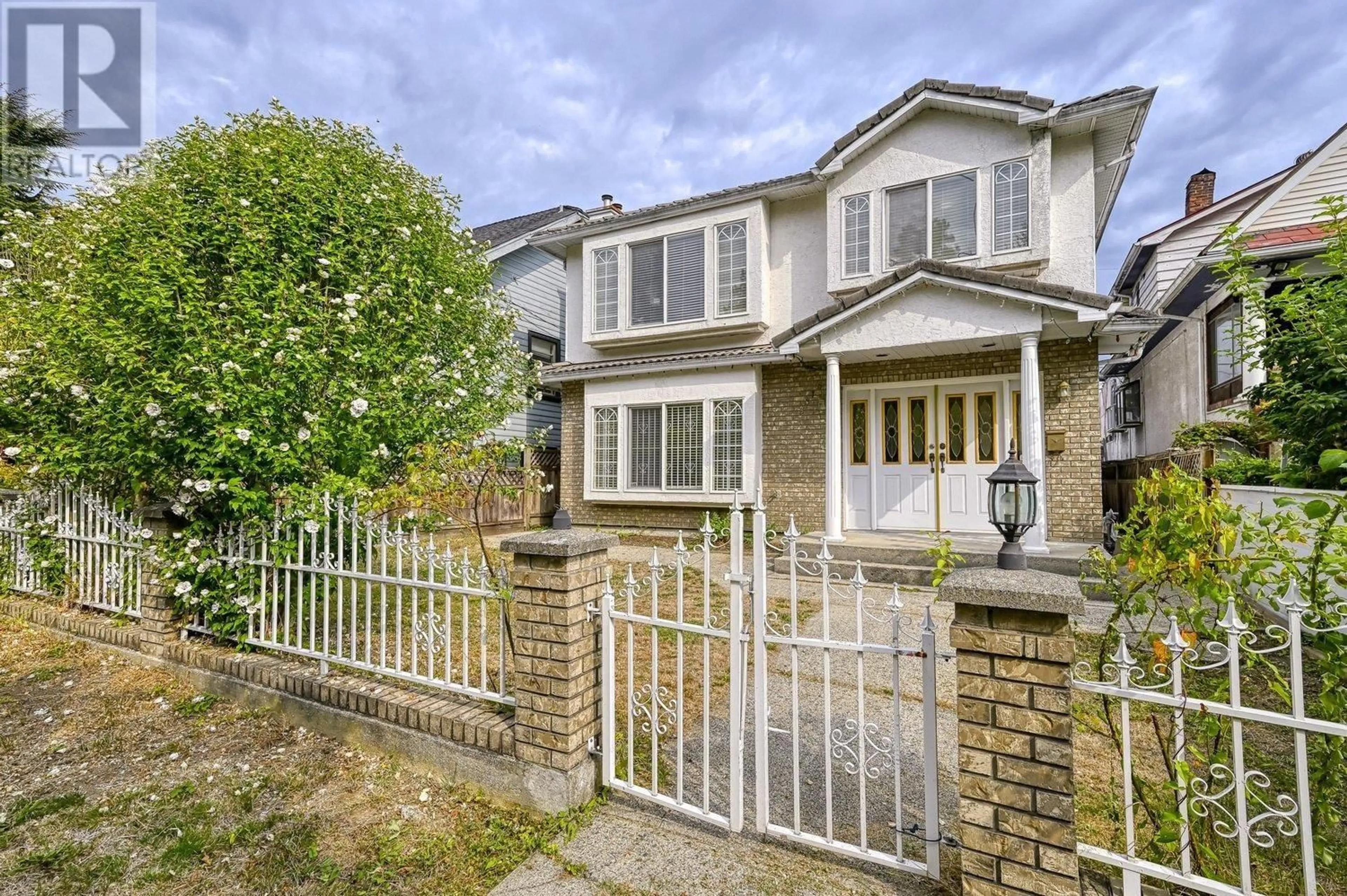 A pic from exterior of the house or condo, the fenced backyard for 3315 CHARLES STREET, Vancouver British Columbia V5K3C3