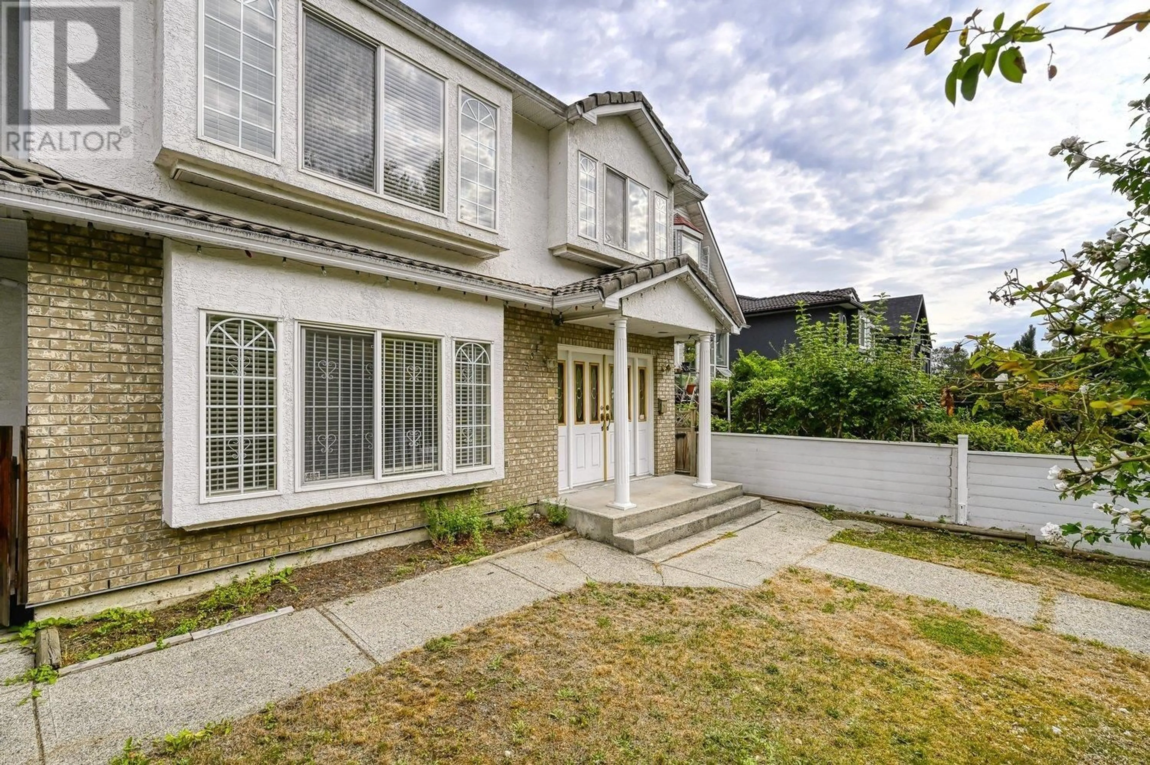 A pic from exterior of the house or condo, the fenced backyard for 3315 CHARLES STREET, Vancouver British Columbia V5K3C3