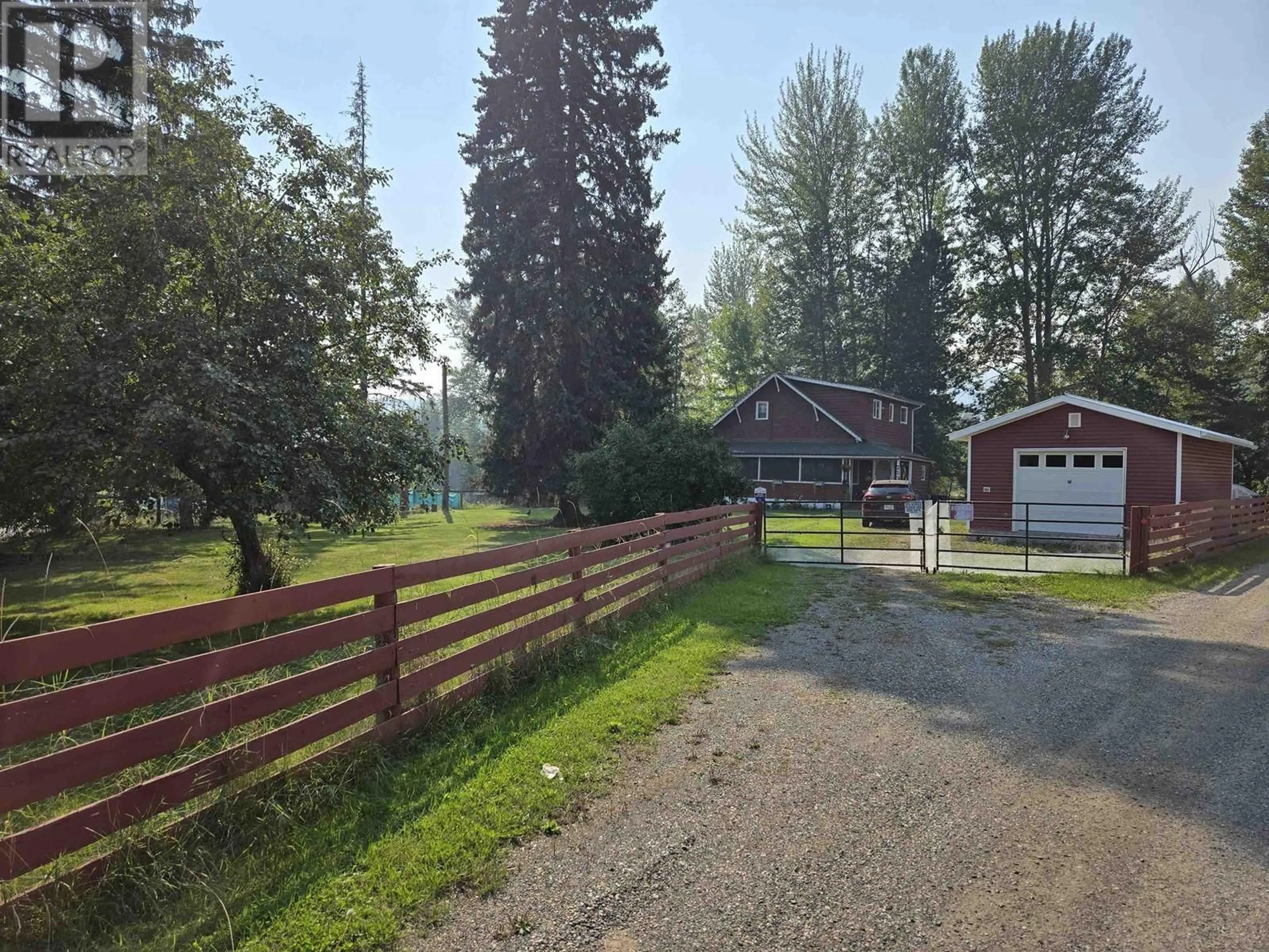 Frontside or backside of a home, the fenced backyard for 213 BAKER DRIVE, Quesnel British Columbia V2J1T8