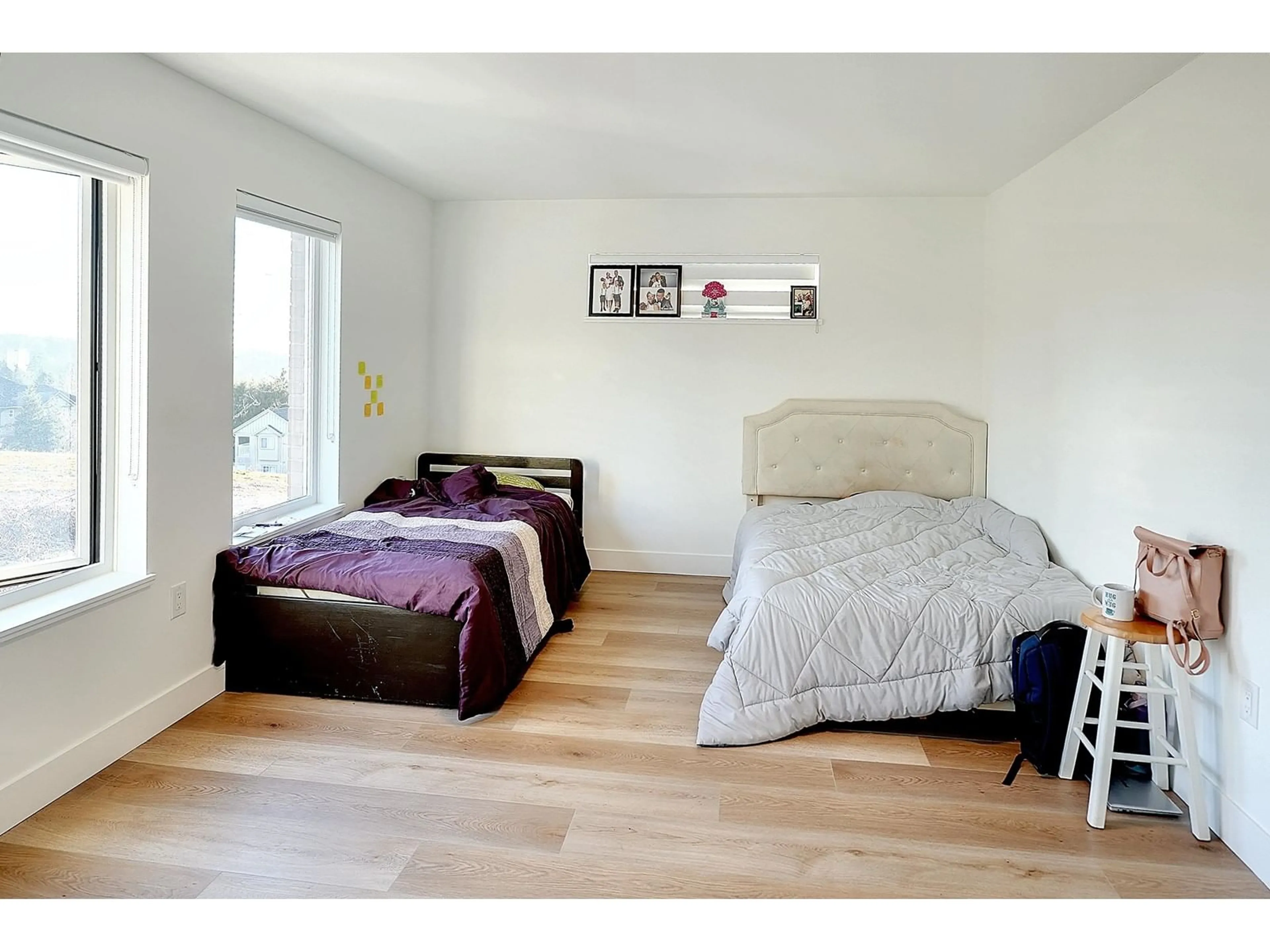 Bedroom with bed, wood/laminate floor for 49 12585 104A AVENUE, Surrey British Columbia V3V0G7